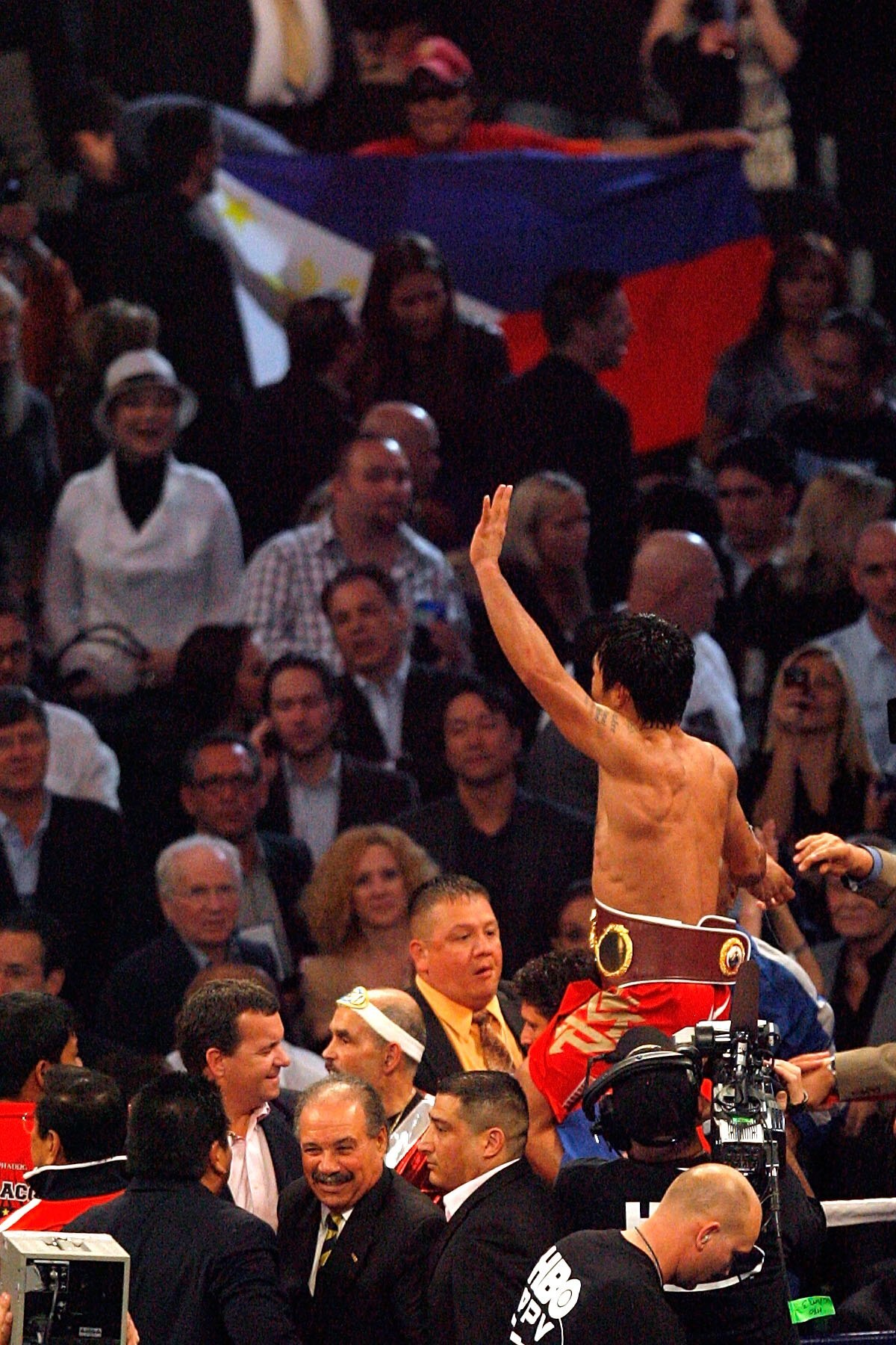 ARLINGTON, TX - MARCH 13:  Manny Pacquiao of the Philippines celebrates in the ring after defeating Joshua Clottey of Ghana during the WBO welterweight title fight at Cowboys Stadium on March 13, 2010 in Arlington, Texas. Pacquiao defeated Clottey by unan