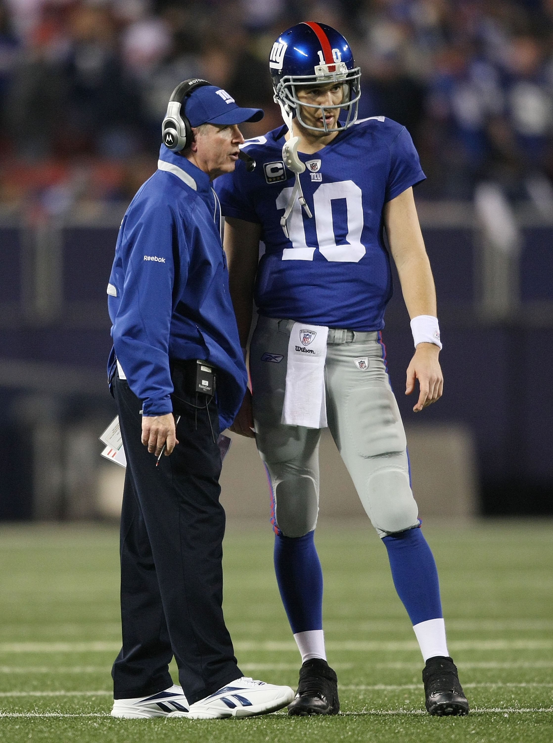EAST RUTHERFORD, NJ - NOVEMBER 8:  Head coach  of the New York Giants Tom Coughlin talks with Eli Manning #10 against the San Diego Chargers at Giants Stadium on November 8, 2009 in East Rutherford, New Jersey. The Chargers defeated the Giants 21-20.  (Ph