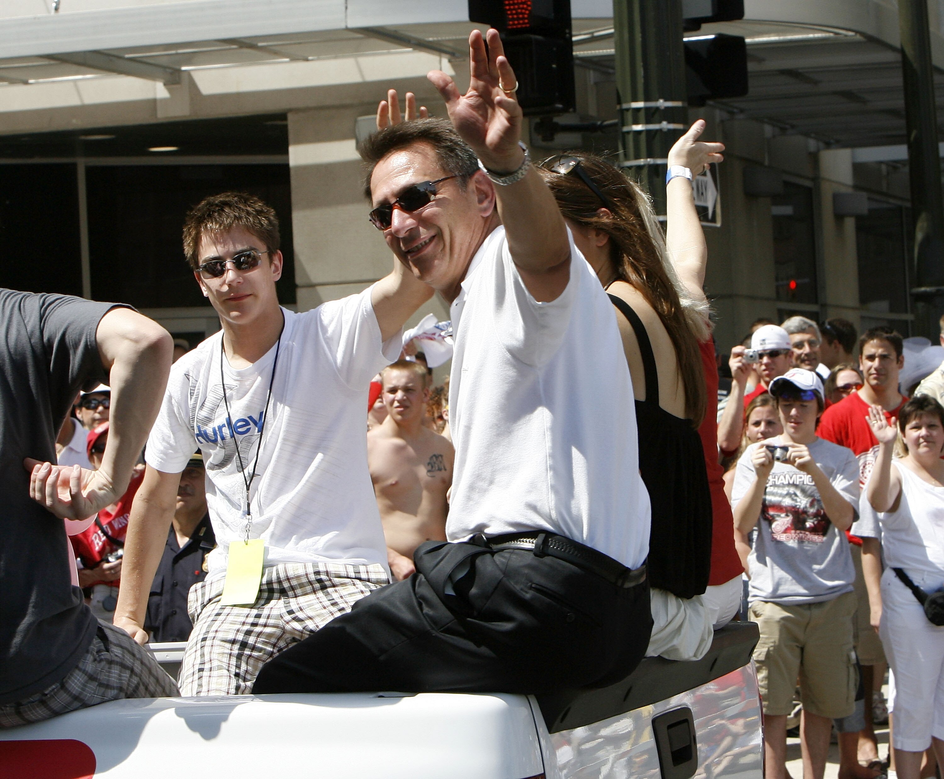 DETROIT - JUNE 06:  Ken Holland general manager of the Detroit Red Wings reacts to fans during a parade to celebrate winning the 2008 Stanley Cup on June 6, 2008 in Detroit, Michigan.  (Photo by Gregory Shamus/Getty Images)