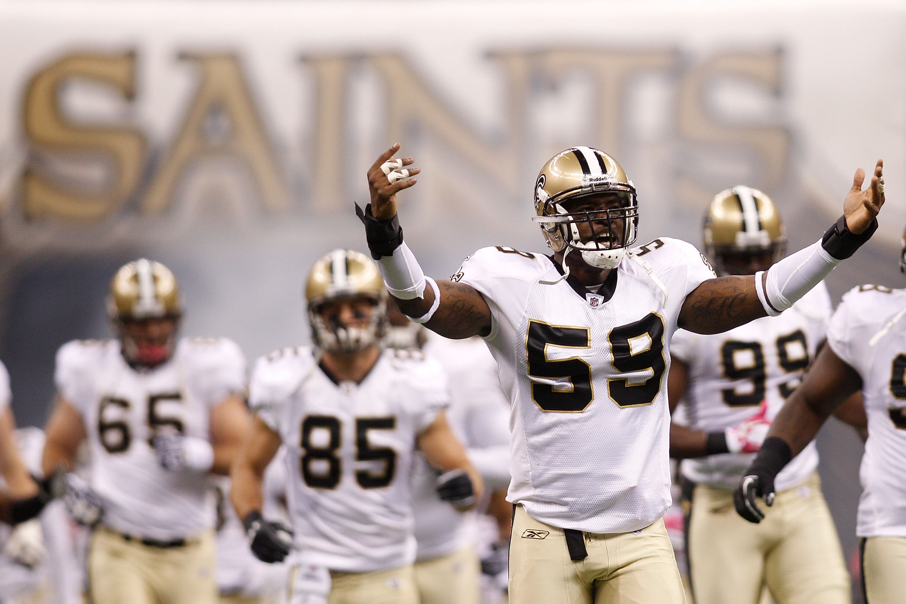 NEW ORLEANS - OCTOBER 24:  Anthony Waters #59 of the New Orleans Saints runs on the field during player introductions before playing against the Cleveland Browns at the Louisiana Superdome on October 24, 2010 in New Orleans, Louisiana.  The Browns defeate