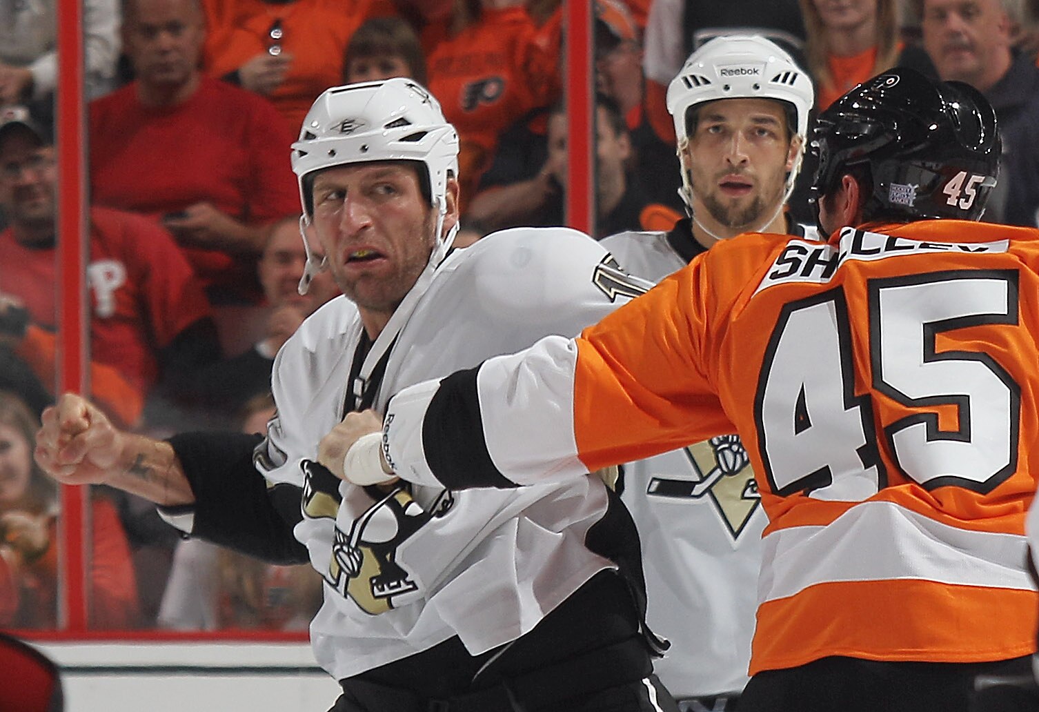 PHILADELPHIA - OCTOBER 16: Michael Rupp #17 of the Pittsburgh Penguins fights with Jody Shelley #45 of the Philadelphia Flyers at the Wells Fargo Center on October 16, 2010 in Philadelphia, Pennsylvania.  The Penguins defeated the Flyers 5-1. (Photo by Br