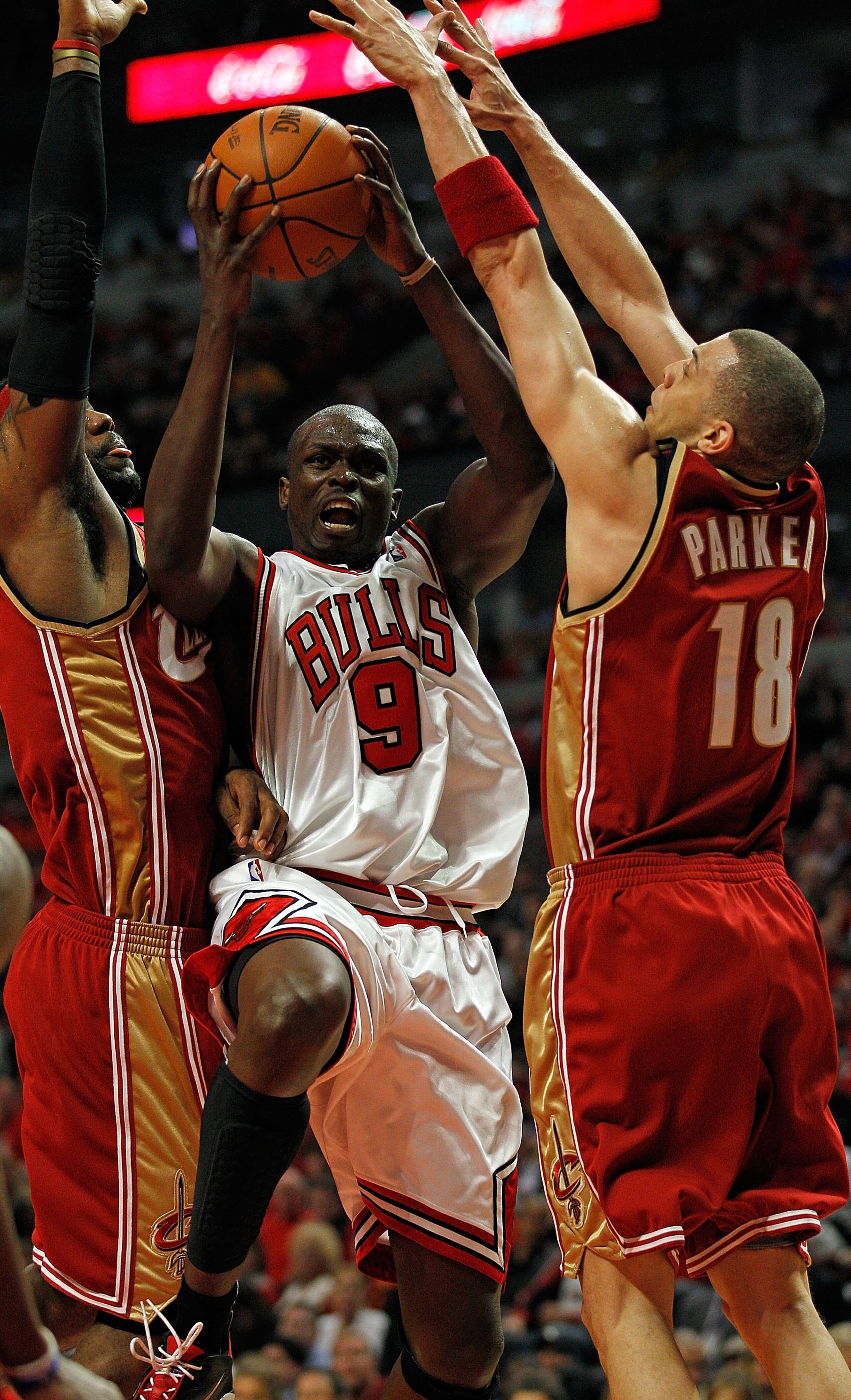 CHICAGO - APRIL 25: Luol Deng #9 of the Chicago Bulls goes up for shot between LeBron James #23 (L) and Anthony Parker #18 of the Cleveland Cavaliers in Game Four of the Eastern Conference Quarterfinals during the 2010 NBA Playoffs at the United Center on CHICAGO - APRIL 25: Luol Deng #9 of the Chicago Bulls goes up for shot between LeBron James #23 (L) and Anthony Parker #18 of the Cleveland Cavaliers in Game Four of the Eastern Conference Quarterfinals during the 2010 NBA Playoffs at the United Center on