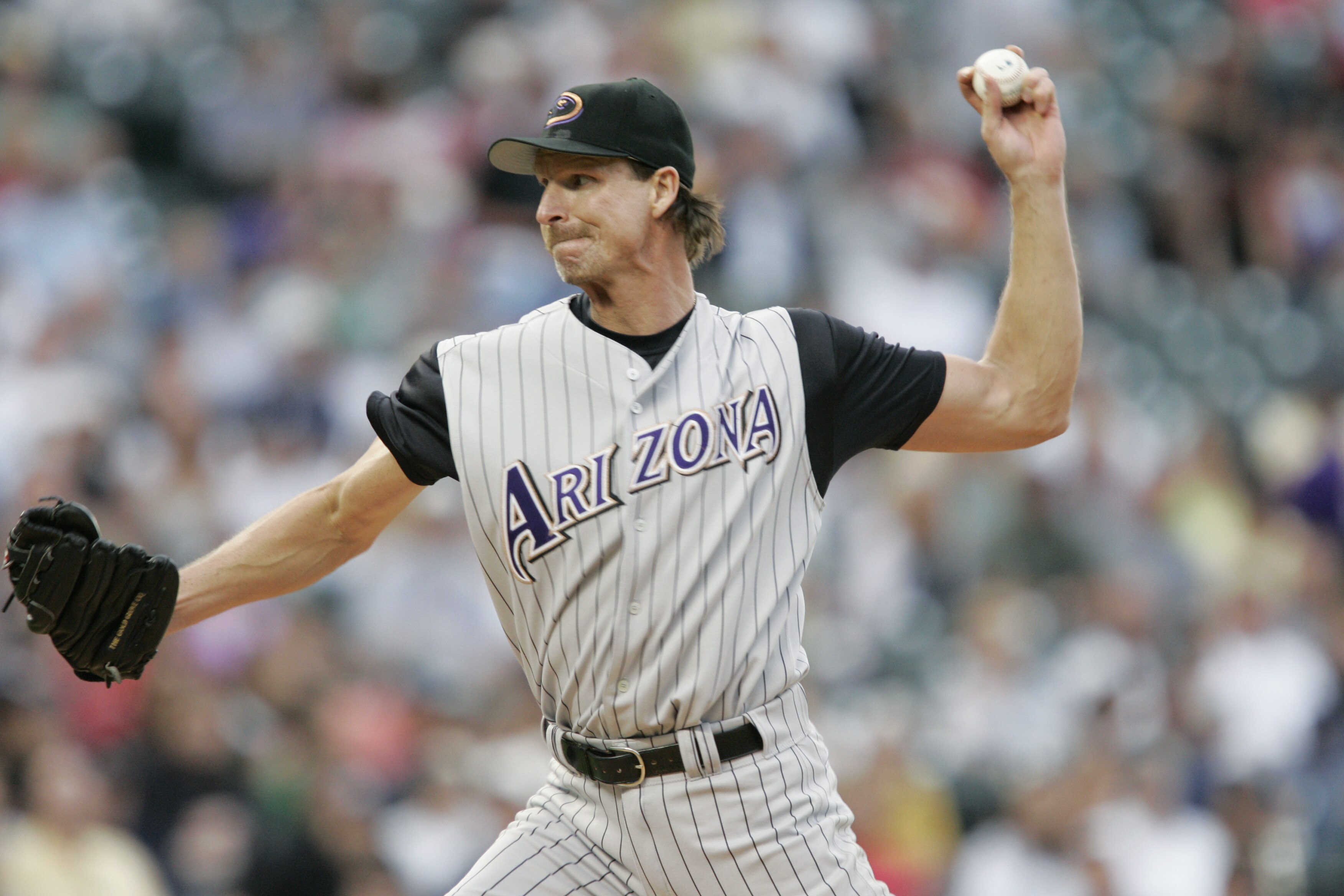 DENVER - JULY 30:  Randy Johnson #51 of the Arizona Diamondbacks throws against the Colorado Rockies on July 30, 2004 at Coors Field in Denver, Colorado.  The Rockies defeated the Diamondbacks 4-1.  (Photo by Brian Bahr/Getty Images)