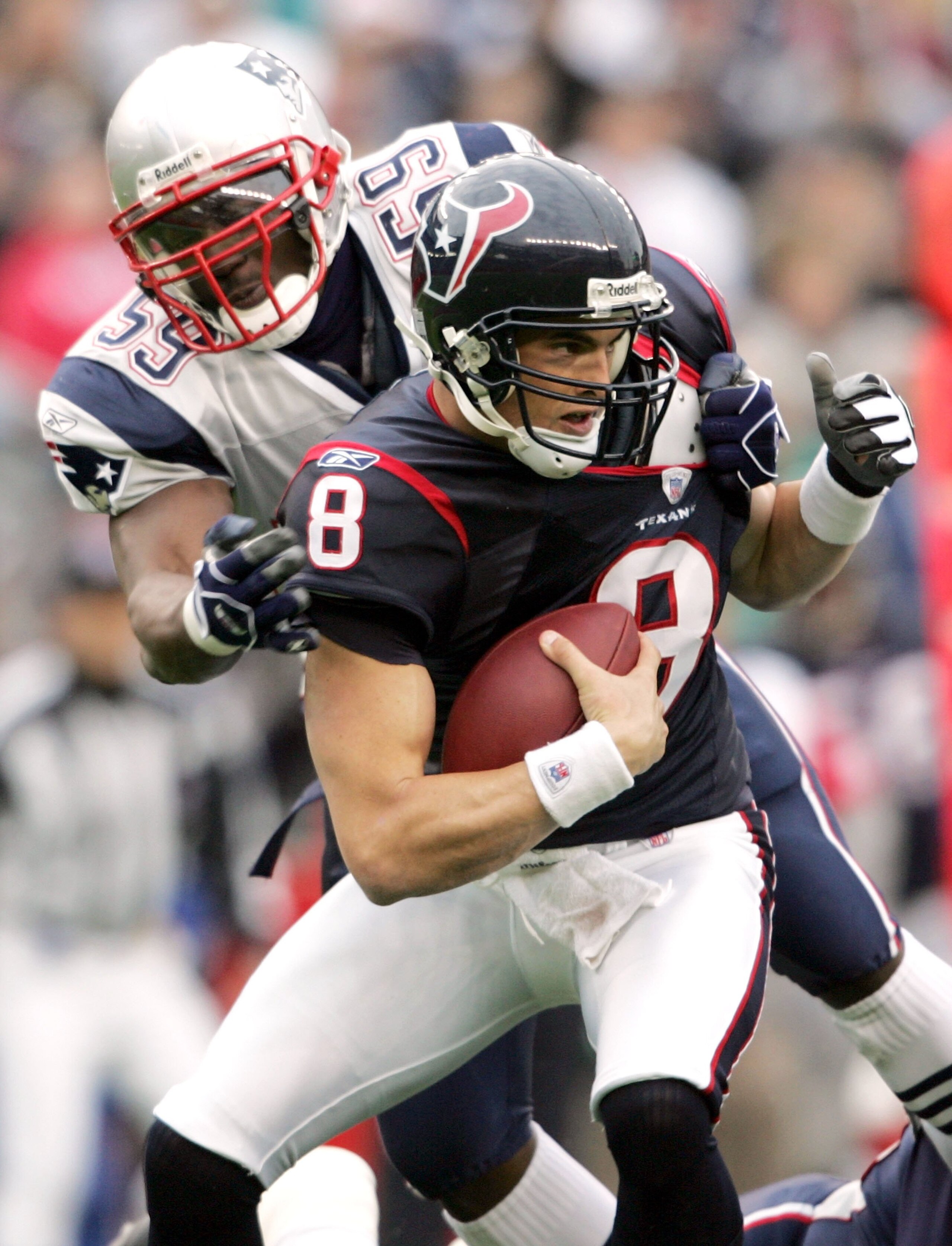 FOXBORO, MA - DECEMBER 17:  David Carr #8 of the Houston Texans is sacked by Rosevelt Colvin #59 of the New England Patriots on December 17, 2006 at Gillette Stadium in Foxboro, Massachusetts.  (Photo by Elsa/Getty Images)