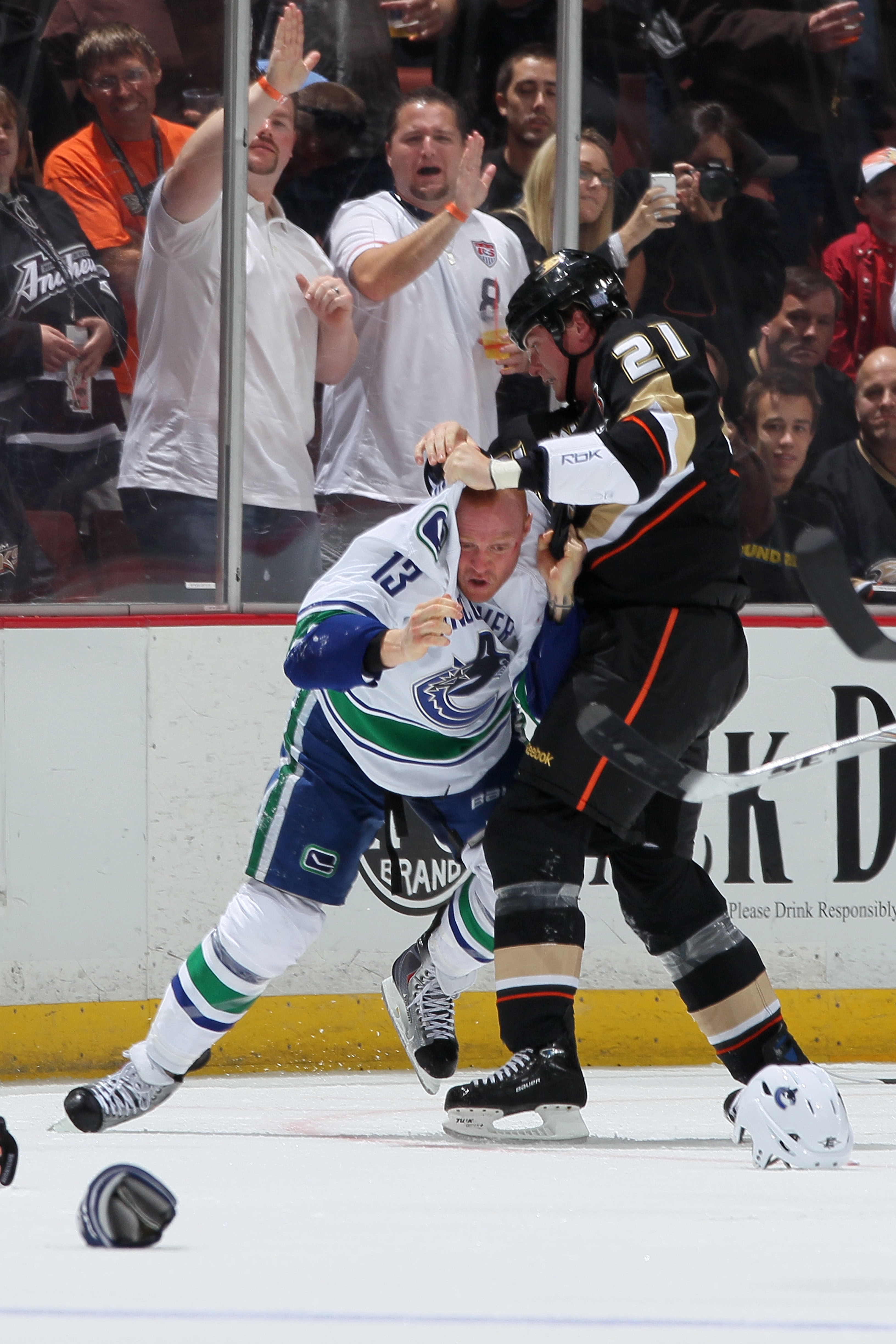 ANAHEIM, CA - OCTOBER 13:  Sheldon Brookbank #21 of the Anaheim Ducks fights with Raffi Torres #13 of the Vancouver Canucks during their game at Honda Center on October 13, 2010 in Anaheim, California.  (Photo by Jeff Gross/Getty Images)