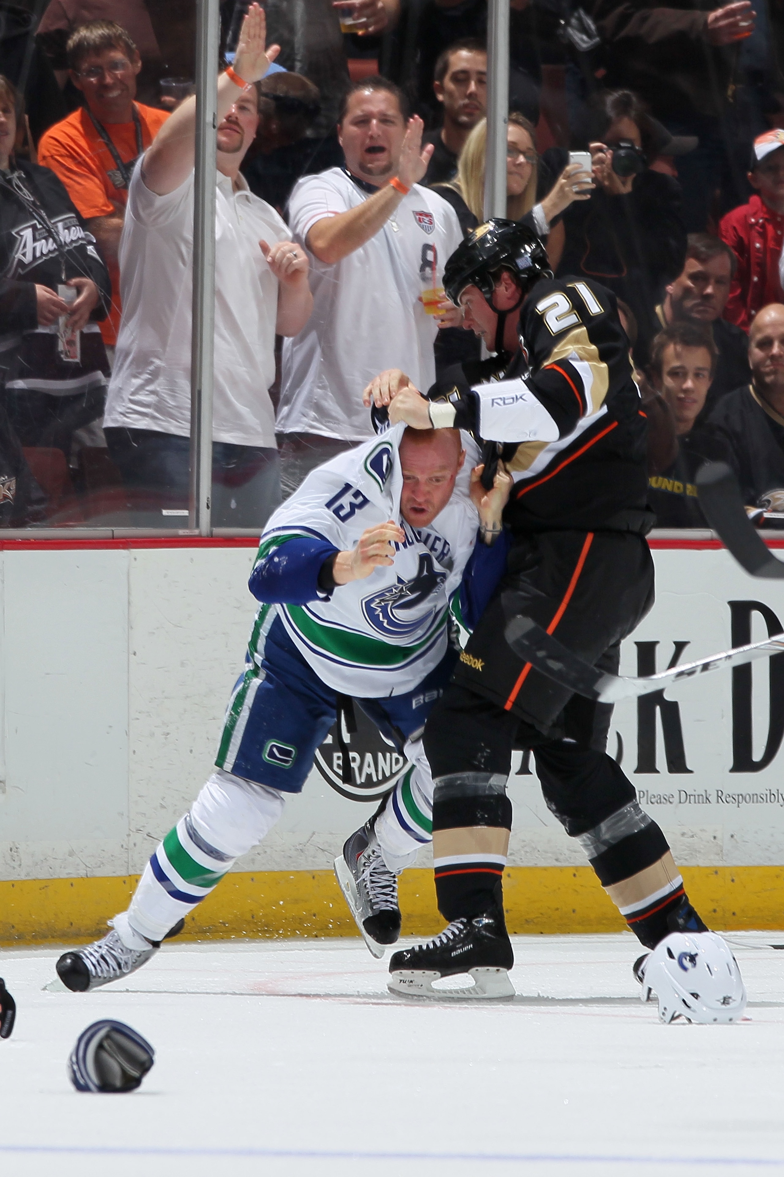ANAHEIM, CA - OCTOBER 13:  Sheldon Brookbank #21 of the Anaheim Ducks fights with Raffi Torres #13 of the Vancouver Canucks during their game at Honda Center on October 13, 2010 in Anaheim, California.  (Photo by Jeff Gross/Getty Images)
