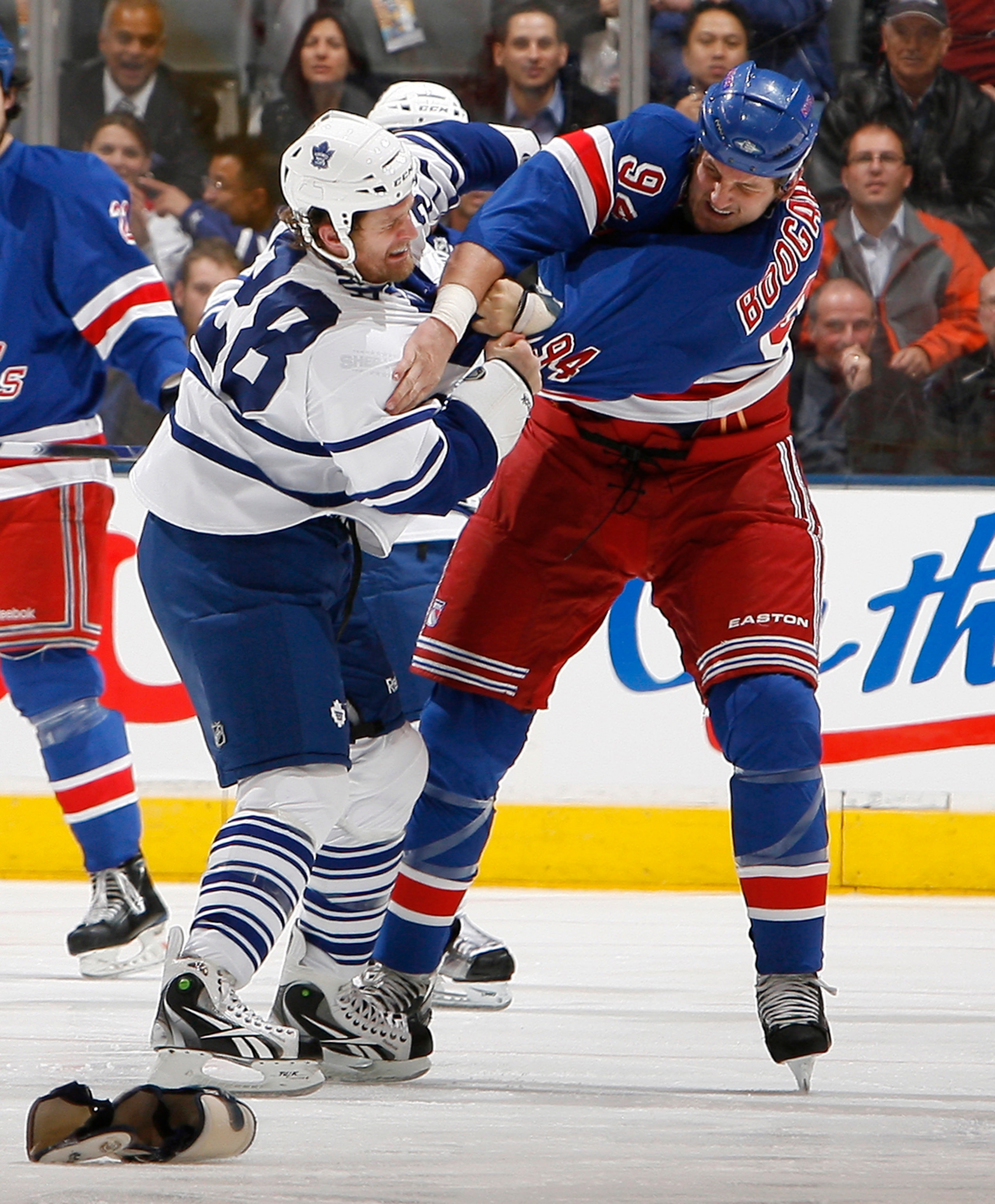 TORONTO - OCTOBER 21: Colton Orr #28 of the Toronto Maple Leafs gets punched by Derek Boogaard #94 of the New York Rangers during game action at the Air Canada Centre October 21, 2010 in Toronto, Ontario, Canada. (Photo by Abelimages/Getty Images)