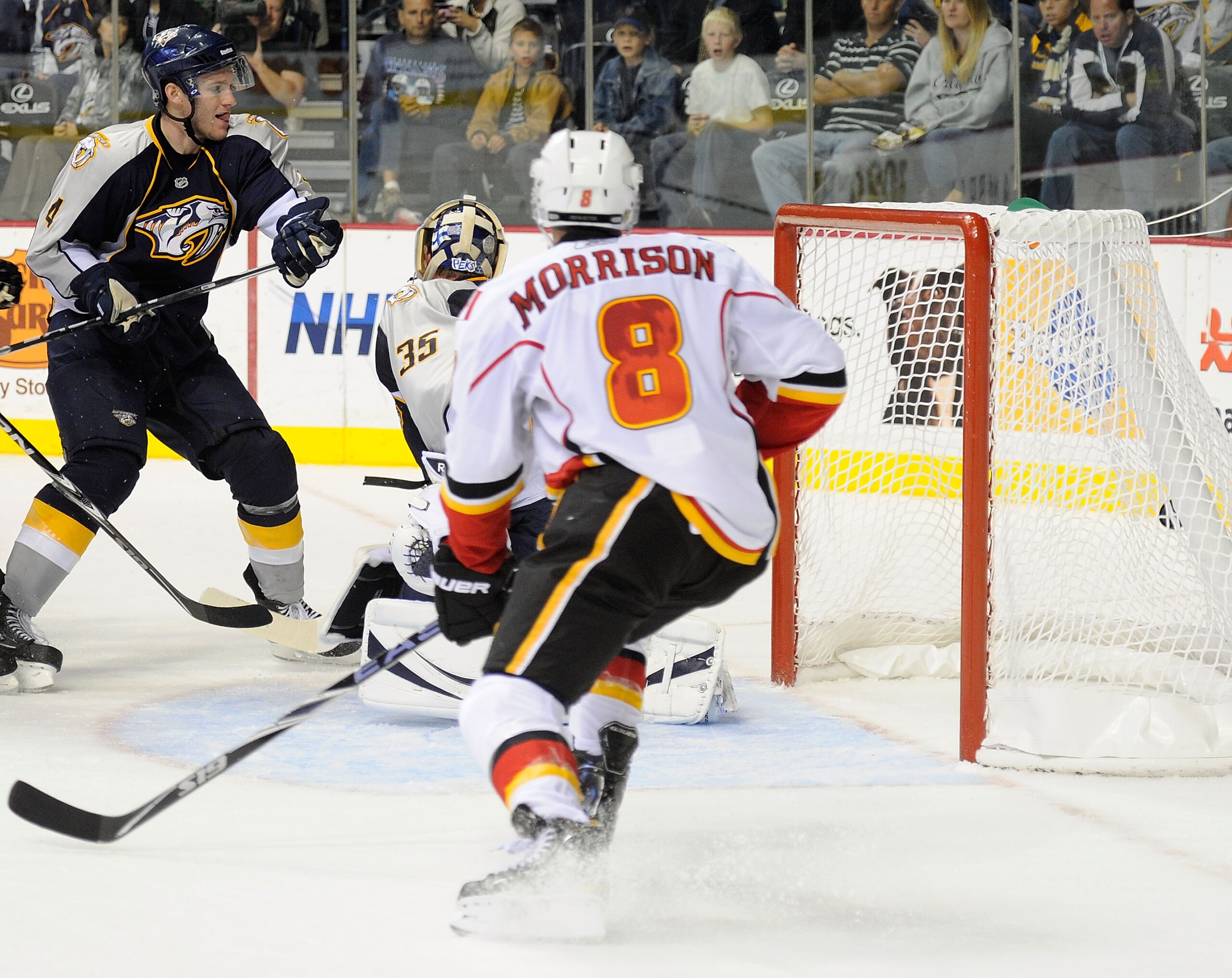 NASHVILLE, TN - OCTOBER 19:  Defenseman Cody Franson #4 of the Nashville Predators and center Brendan Morrison #8 of the Calgary Flames watch the puck go in behind Predators goalie Pekka Rinne #35 for the game winning overtime goal on October 19, 2010 in