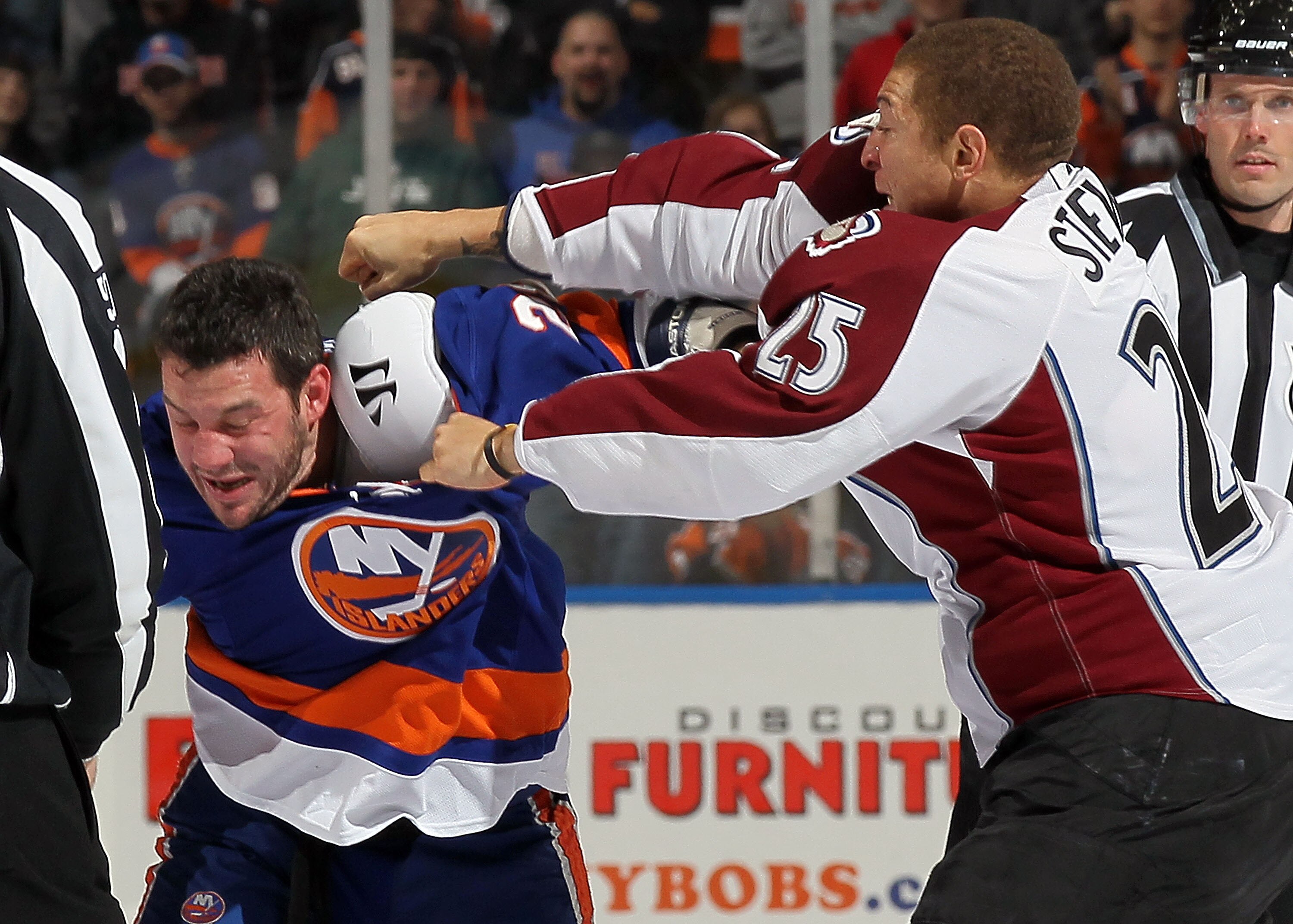 UNIONDALE, NY - OCTOBER 16:  Chris Stewart #25 of the Colorado Avalanche trades punches with Zenon Konopka #28 of the New York Islanders five seconds into their game on October 16, 2010 at Nassau Coliseum in Uniondale, New York.  (Photo by Jim McIsaac/Get