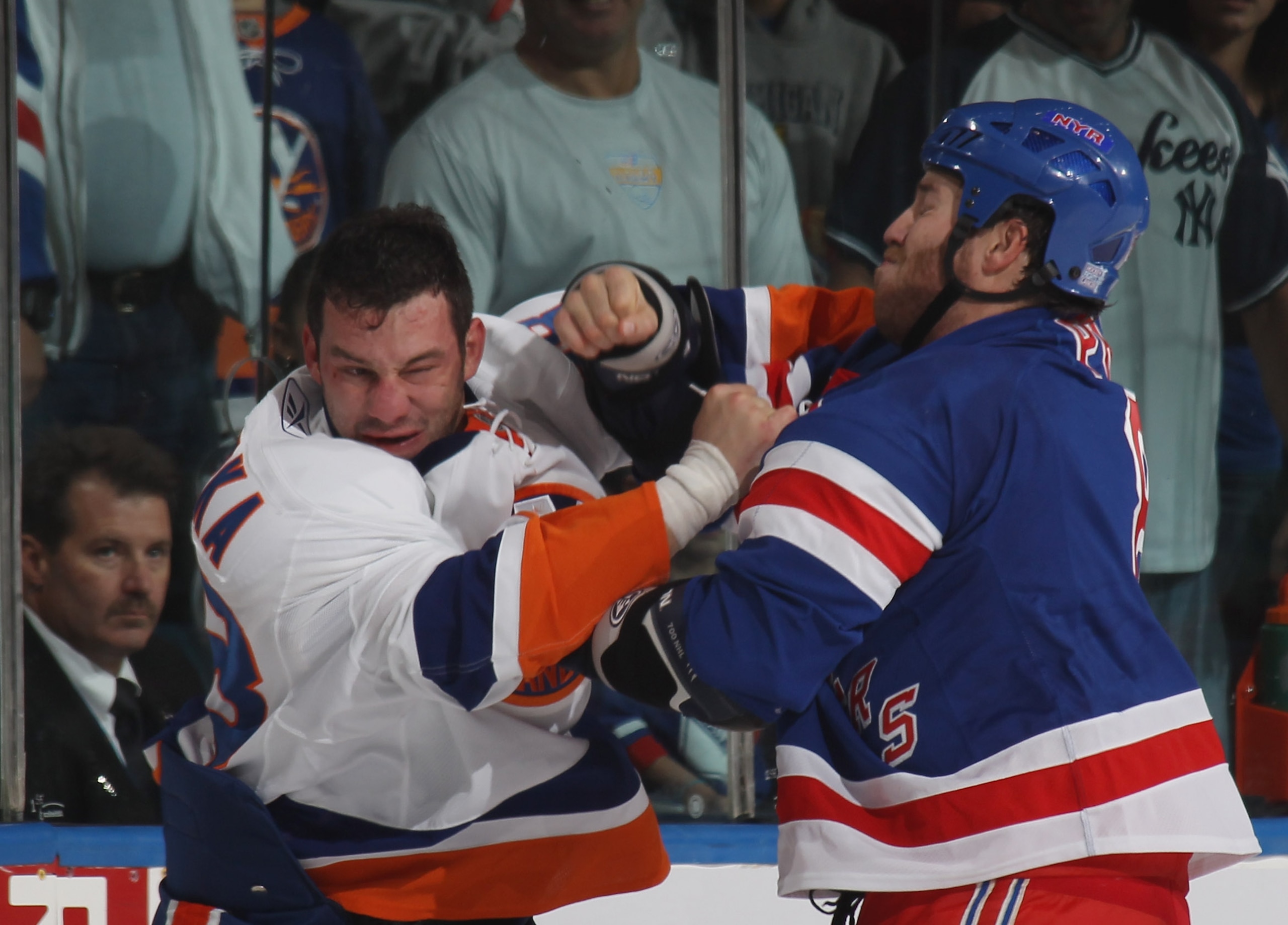 UNIONDALE, NY - OCTOBER 11: Zenon Konopka #28 of the New York Islanders and Brandon Prust #10 of the New York Rangers fight during the first period at the Nassau Coliseum on October 11, 2010 in Uniondale, New York.  (Photo by Bruce Bennett/Getty Images)