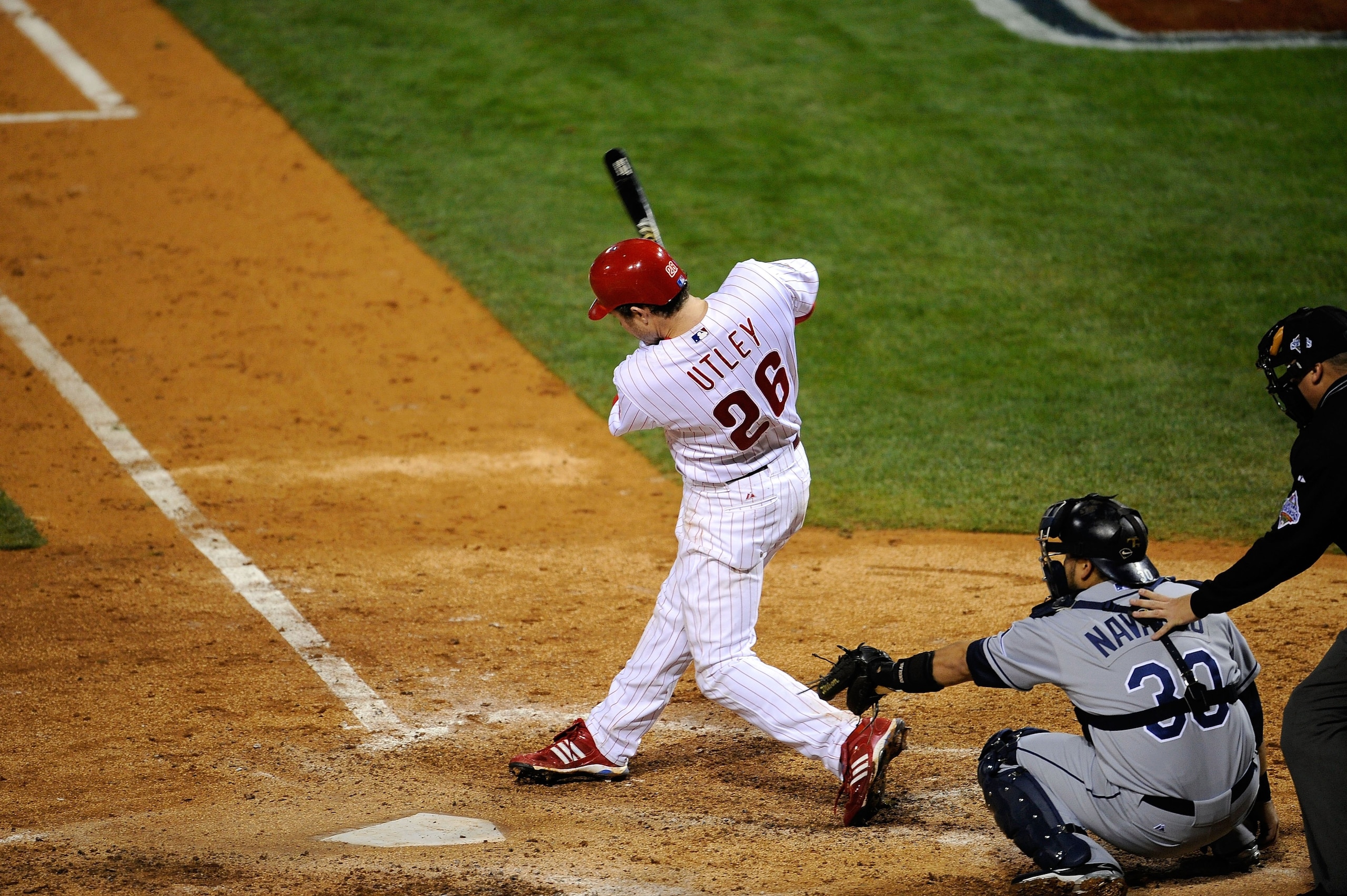 PHILADELPHIA - OCTOBER 25: Chase Utley #26 of the Philadelphia Phillies hits a solo home run in the bottom of the sixth inning against the Tampa Bay Rays during game three of the 2008 MLB World Series on October 25, 2008 at Citizens Bank Park in Philadel PHILADELPHIA - OCTOBER 25: Chase Utley #26 of the Philadelphia Phillies hits a solo home run in the bottom of the sixth inning against the Tampa Bay Rays during game three of the 2008 MLB World Series on October 25, 2008 at Citizens Bank Park in Philadel