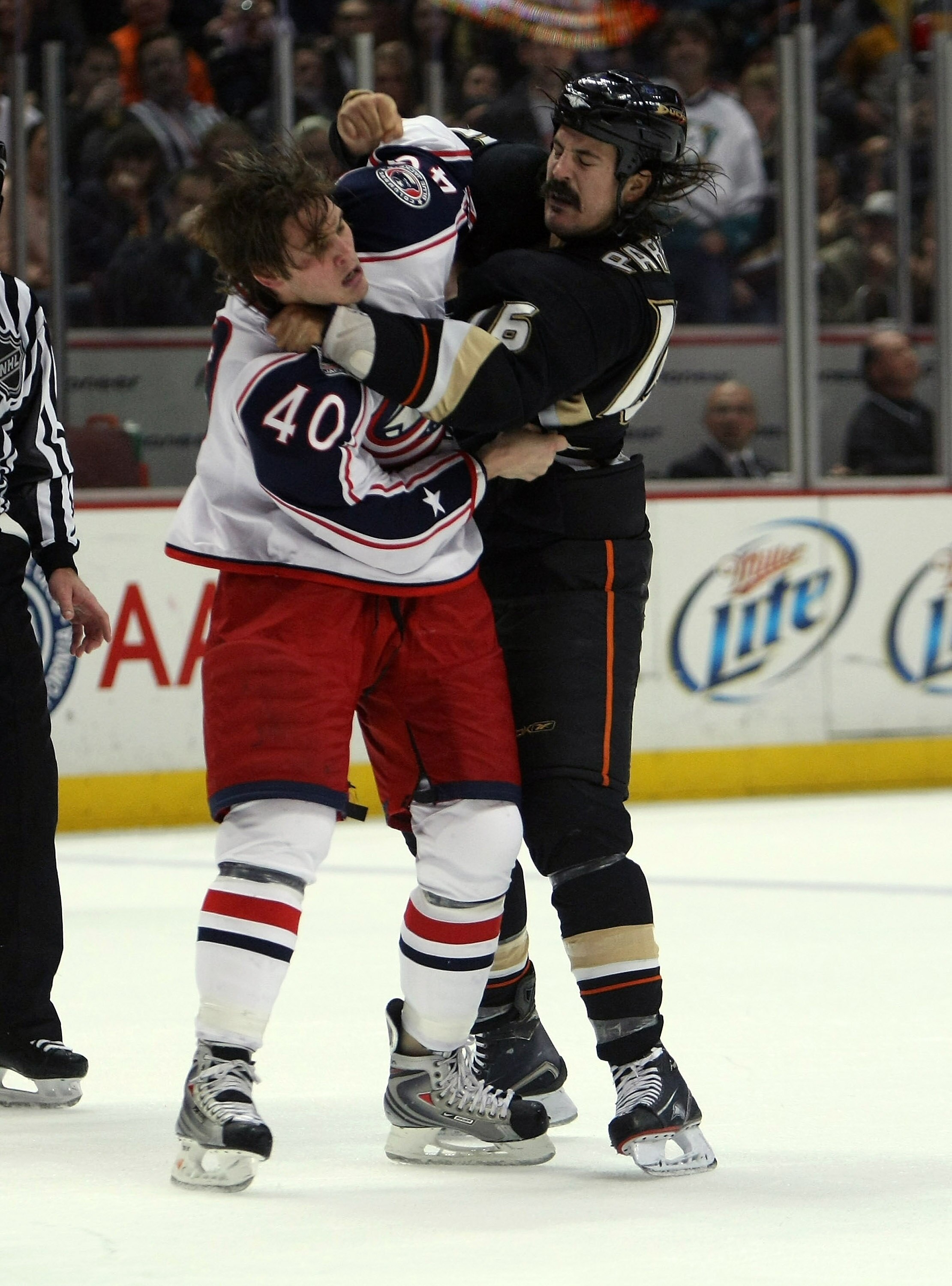 ANAHEIM, CA - DECEMBER 07: George Parros #16 of the Anaheim Ducks fights with Jared Boll #40 of the Columbus Blue Jackets on December 7, 2008 at the Honda Center in Anaheim, California.  The Ducks won 5-3.  (Photo by Stephen Dunn/Getty Images)