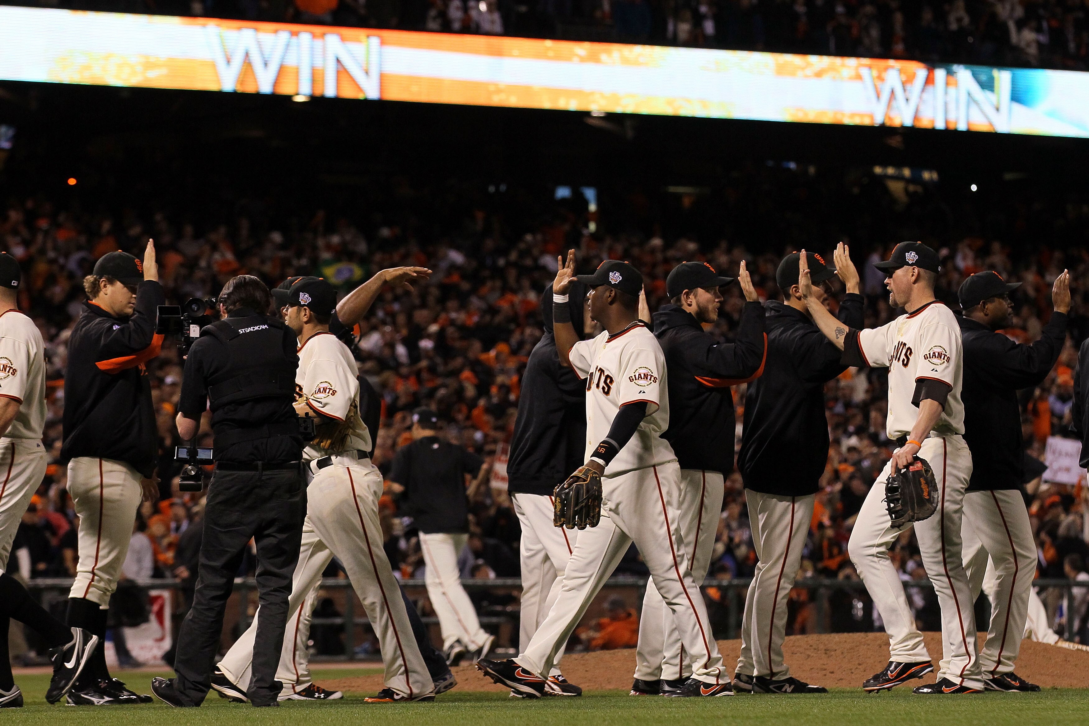 SAN FRANCISCO - OCTOBER 28:  The San Francisco Giants celebrate after their 9-0 victory against the Texas Rangers in Game Two of the 2010 MLB World Series at AT&T Park on October 28, 2010 in San Francisco, California.  (Photo by Justin Sullivan/Getty Imag