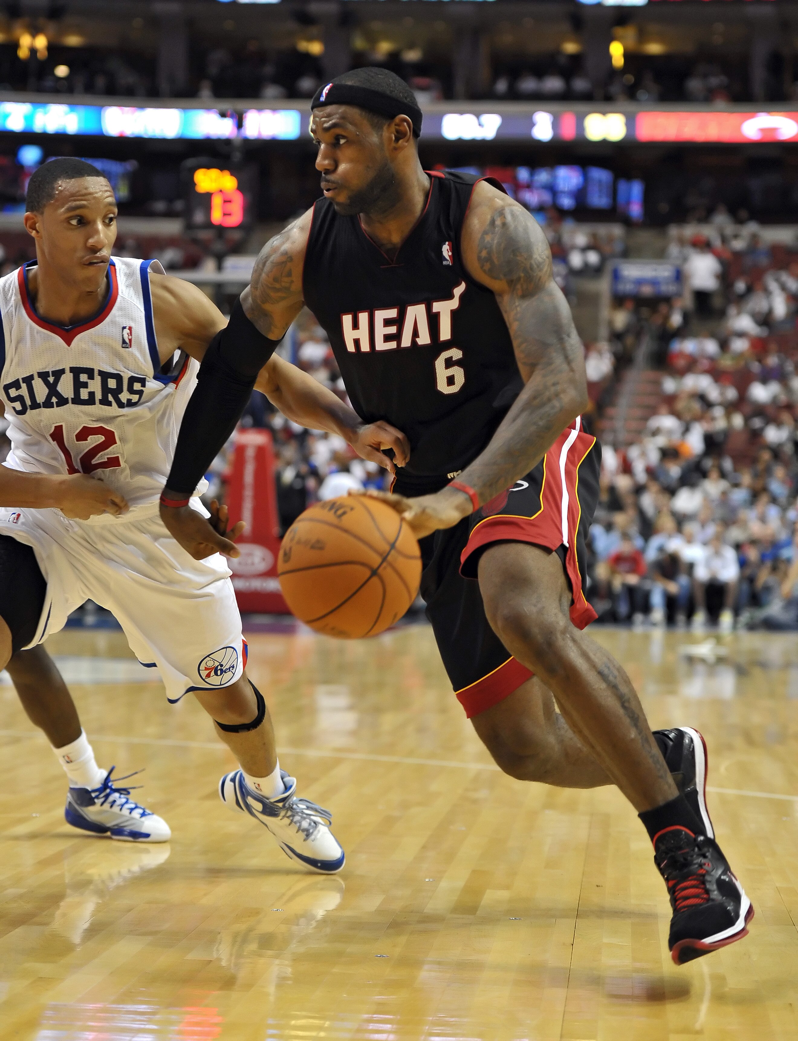 PHILADELPHIA - OCTOBER 27:  LeBron James #6 of the Miami Heat  drives around Evan Turner #12 of the Philadelphia 76ers at the Wells Fargo Center on October 27, 2010 in Philadelphia, Pennsylvania. NOTE TO USER: User expressly acknowledges and agrees that,