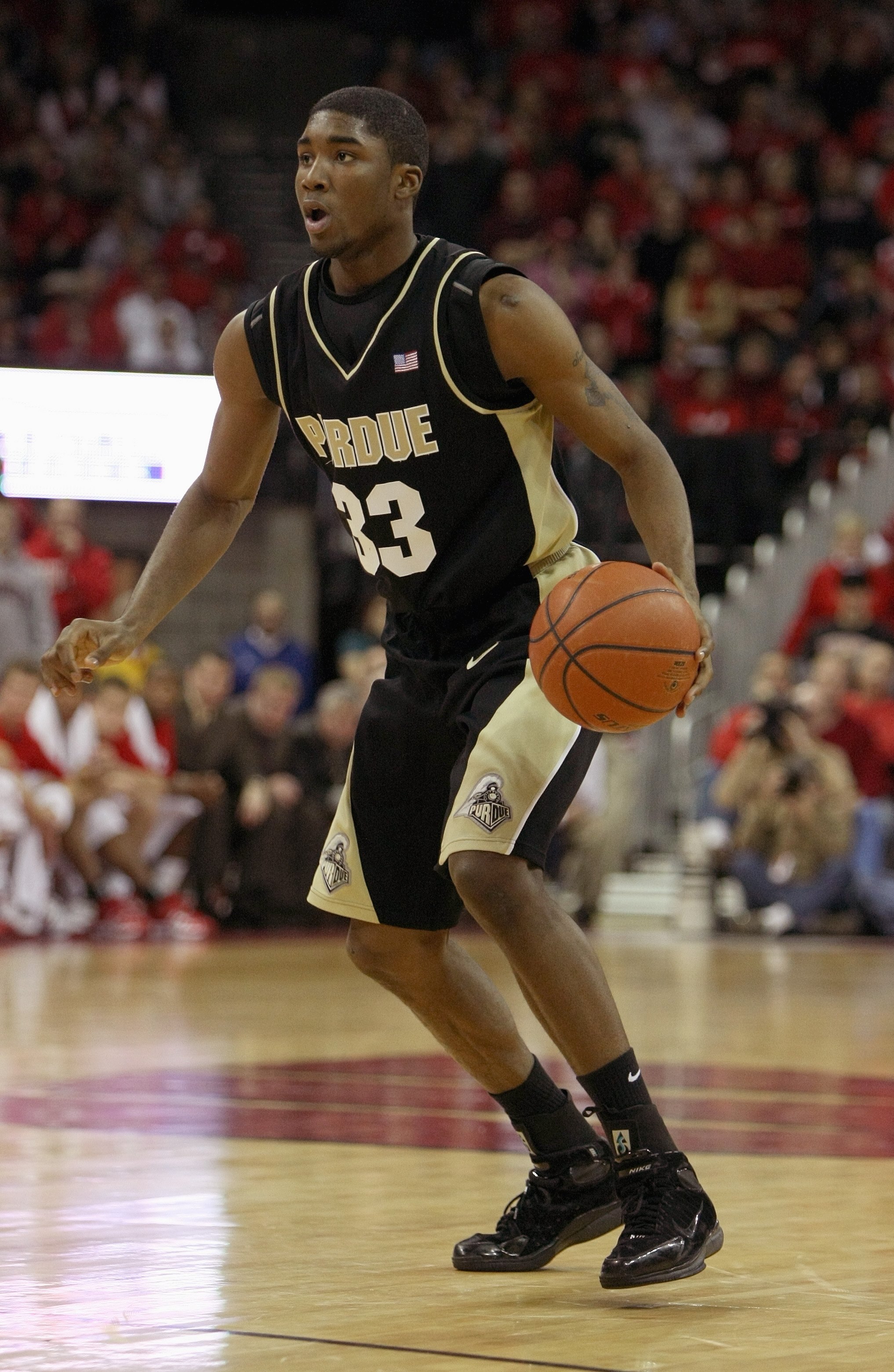 MADISON, WI - FEBRUARY 09: E'Twaun Moore #33 of the Purdue Boilermakers dribbles the ball during the game against the Wisconsin Badgers on February 9, 2008 at the Kohl Center in Madison, Wisconsin. Purdue defeated Wisconsin 72-67. (Photo by Jonathan Danie
