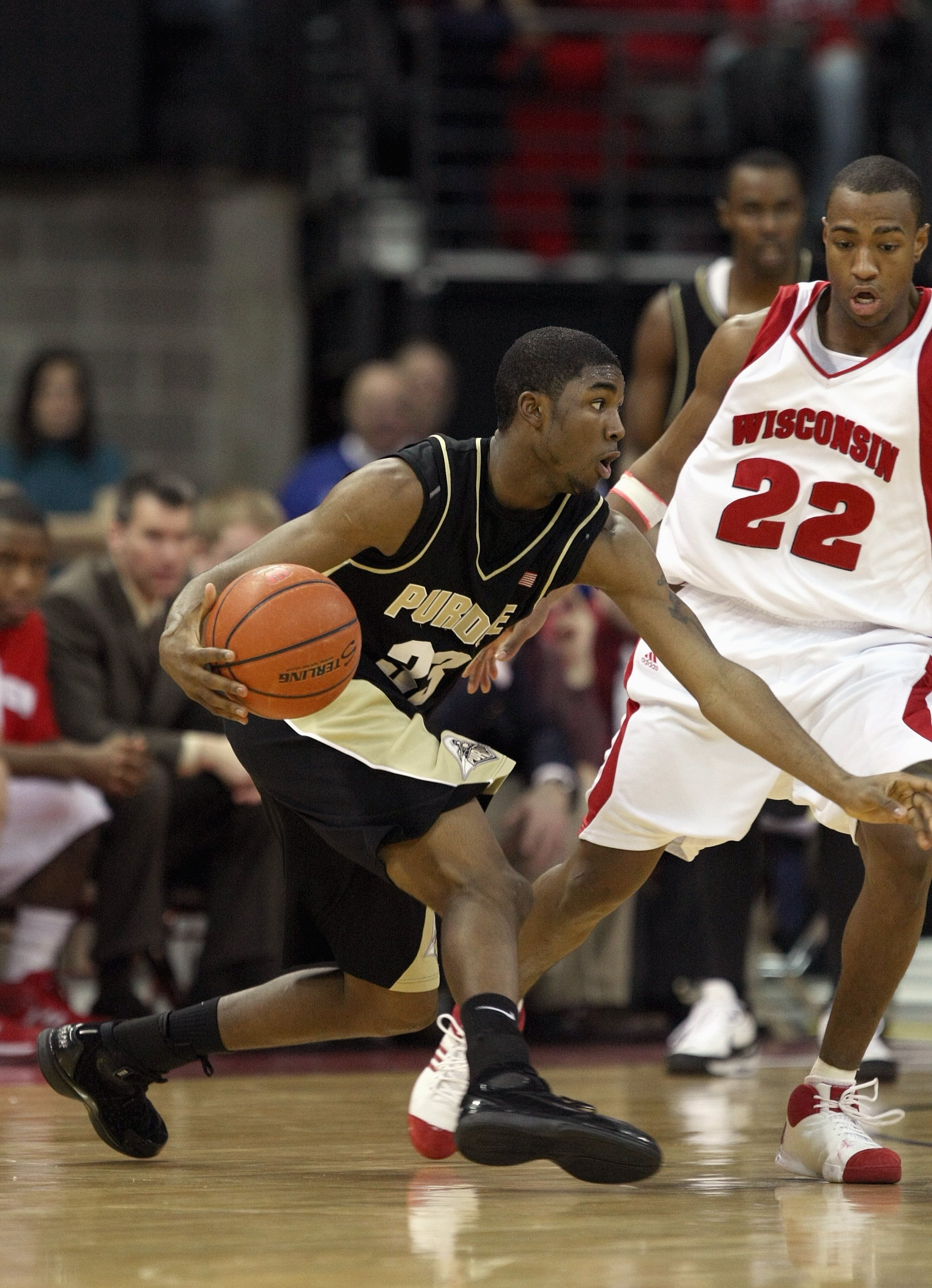 MADISON, WI - FEBRUARY 09: E'Twaun Moore #33 of the Purdue Boilermakers drives the ball during the game against the Wisconsin Badgers on February 9, 2008 at the Kohl Center in Madison, Wisconsin. Purdue defeated Wisconsin 72-67. (Photo by Jonathan Daniel/