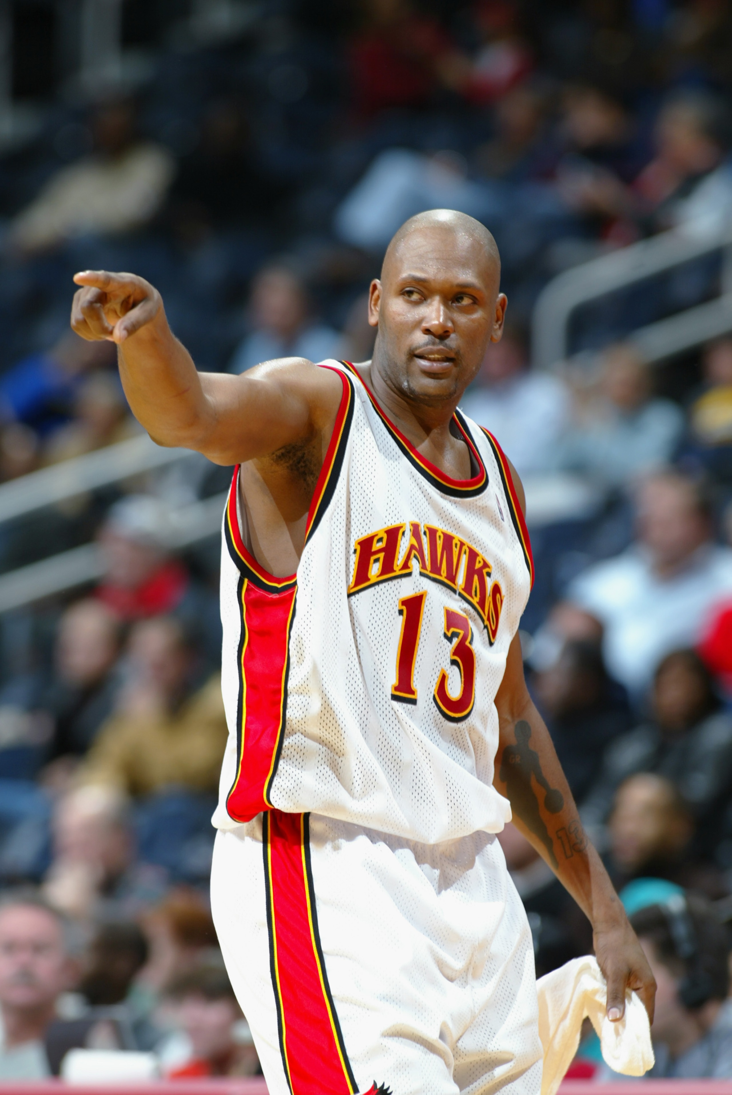 ATLANTA - DECEMBER 5:  Glenn Robinson #13 of the Atlanta Hawks points as he walks to the bench during the NBA game against the Milwaukee Bucks at Phillips Arena on December 5, 2002 in Atlanta, Georgia.  The Hawks won 98-80.  NOTE TO USER: User expressly a