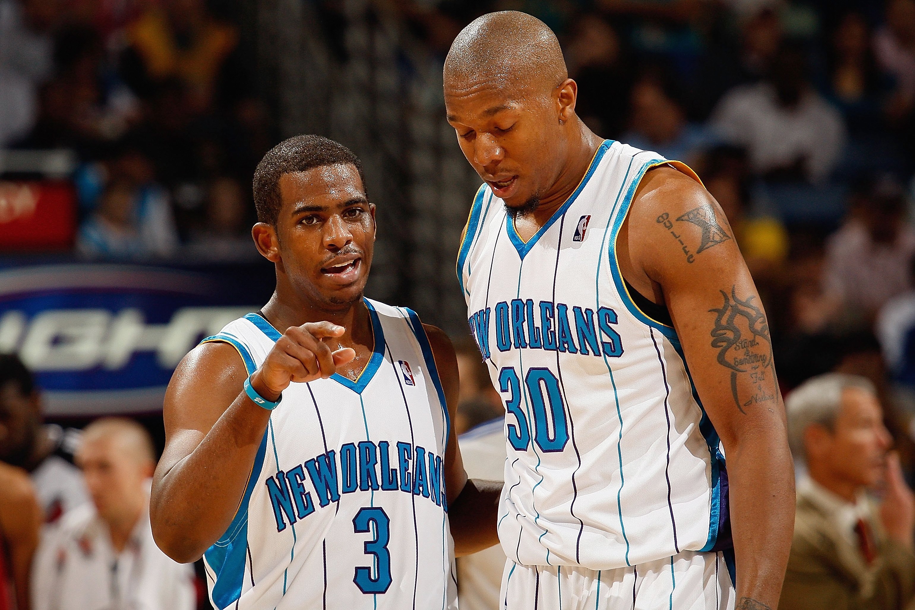 NEW ORLEANS - NOVEMBER 14:  Chris Paul #3 and David West #30 of the New Orleans Hornets talk on the court during the game against the Portland Trail Blazers at the New Orleans Arena on November 14, 2008 in New Orleans, Louisiana.  The Hornets defeated the