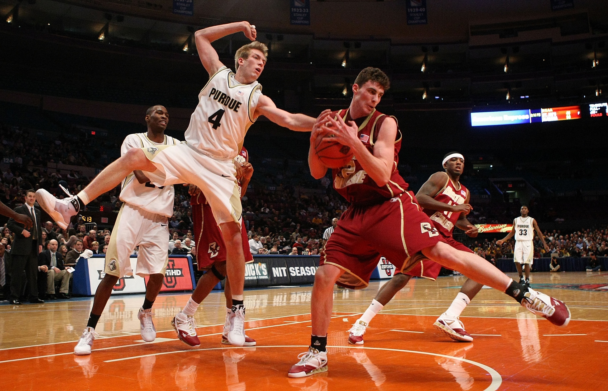NEW YORK - NOVEMBER 26:  Joe Trapani #12 of the Boston College Eagles and Robbie Hummel #4 of Purdue Boilermakers fight for a rebound during the pre-season NIT at Madison Square Garden November 26, 2008 in New York City.  (Photo by Nick Laham/Getty Images