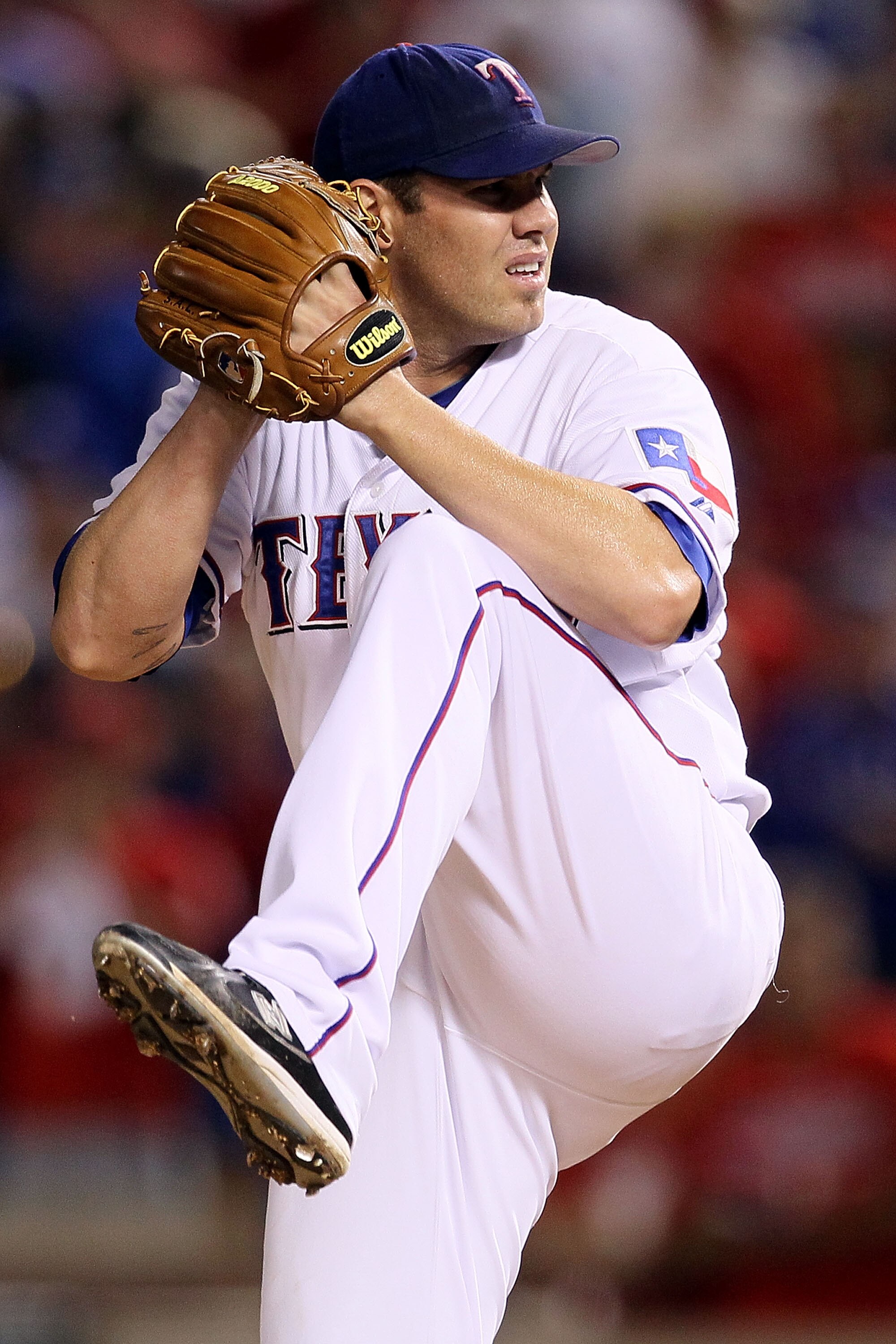 ARLINGTON, TX - OCTOBER 22:  Starting pitcher Colby Lewis #48 of the Texas Rangers pitches against the New York Yankees in the first inning of Game Six of the ALCS during the 2010 MLB Playoffs at Rangers Ballpark in Arlington on October 22, 2010 in Arling