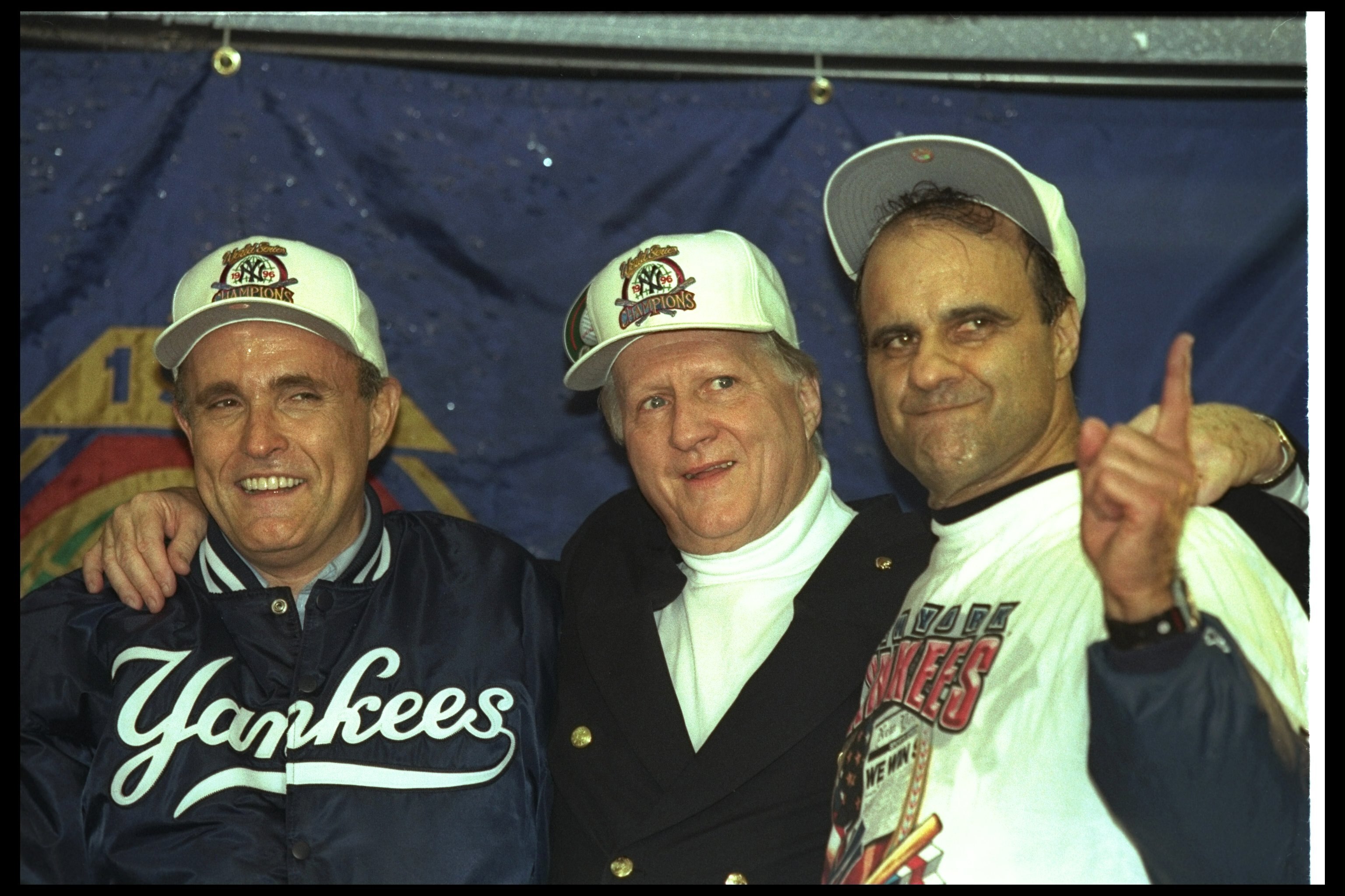 26 Oct 1996: New York City mayor Rudy Guilliani, George Steinbrenner, and New York Yankees manager Joe Torre celebrate after Game Six of the World Series against the Atlanta Braves at Yankee Stadium in New York City, New York. The Yankees won the game, 3-