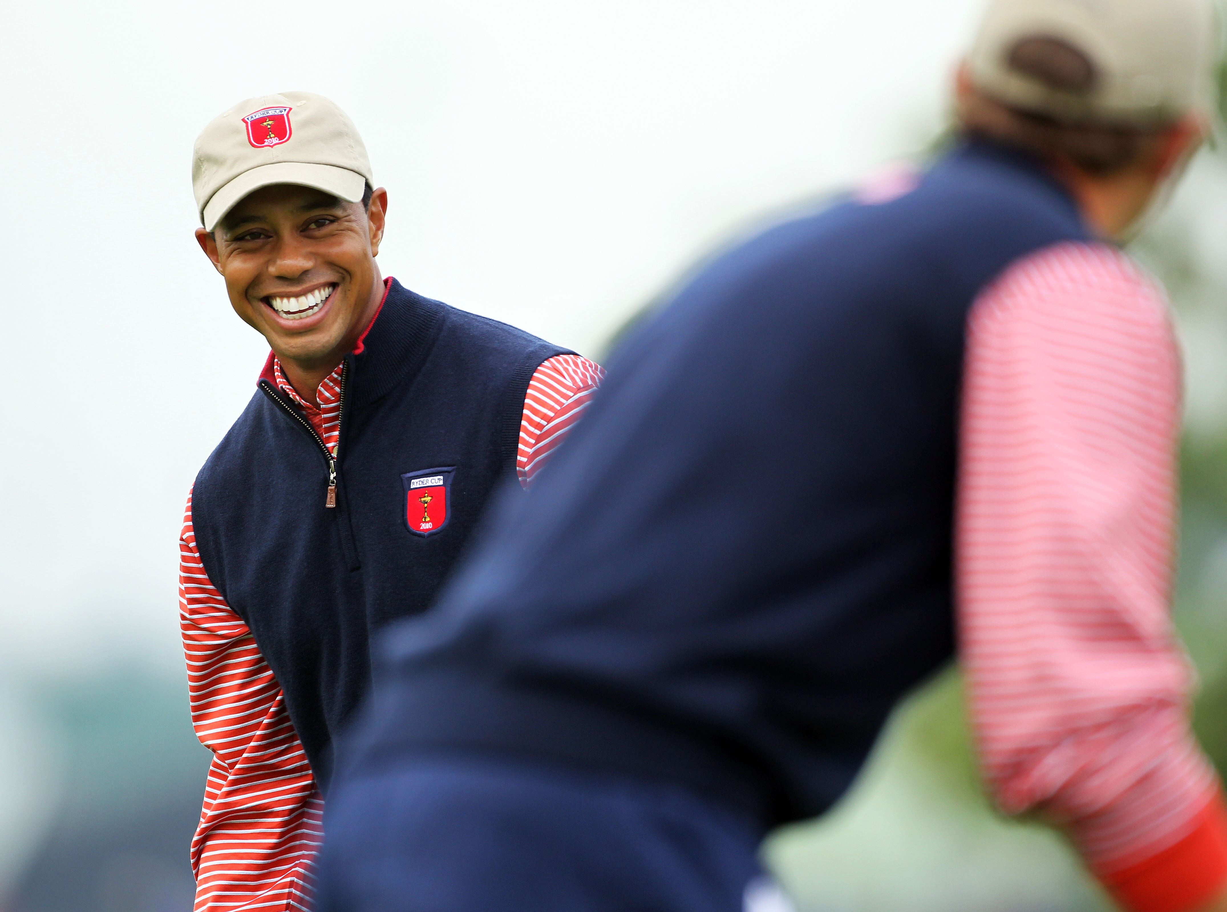 NEWPORT, WALES - SEPTEMBER 30:  Tiger Woods of the USA chats with Dustin Johnson (R) during a practice round prior to the 2010 Ryder Cup at the Celtic Manor Resort on September 30, 2010 in Newport, Wales.  (Photo by Andy Lyons/Getty Images)