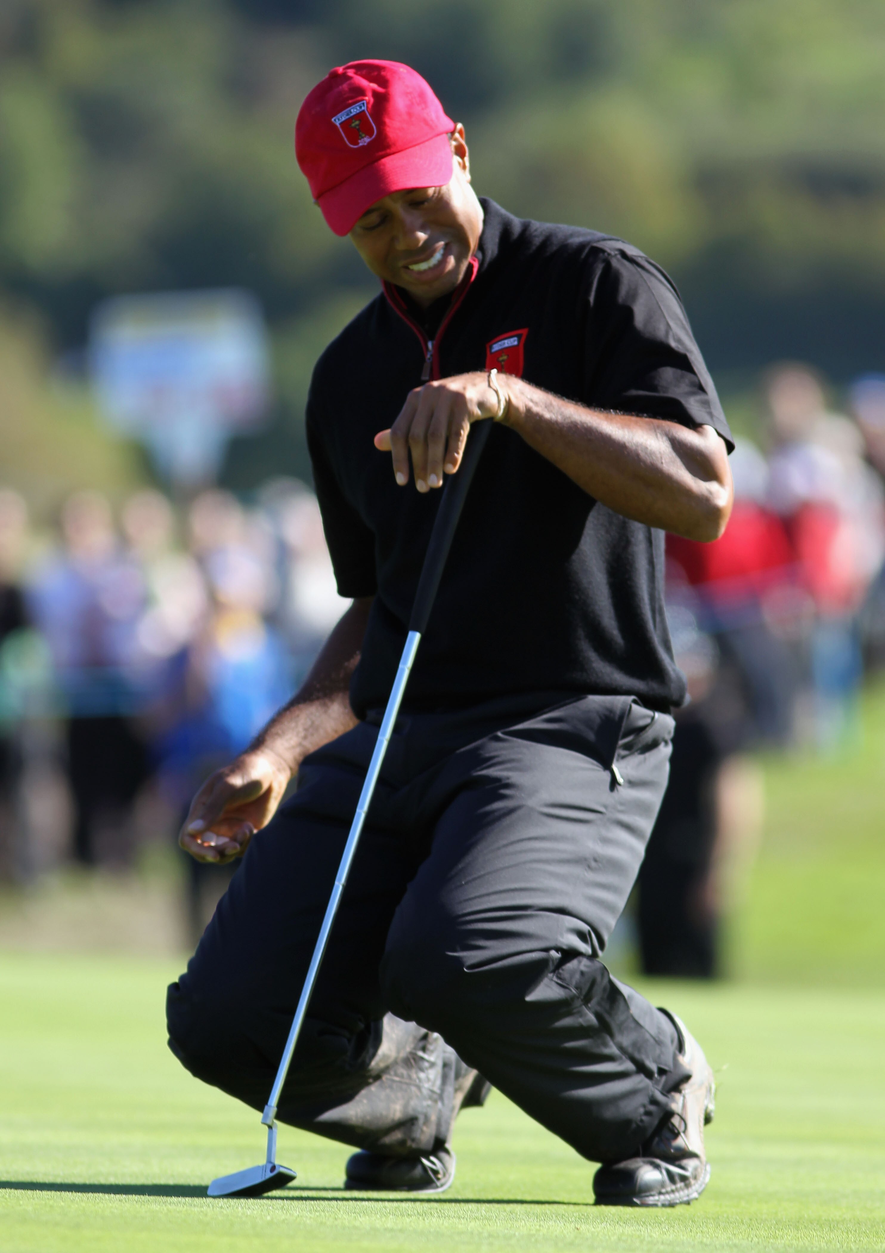 NEWPORT, WALES - OCTOBER 04:  Tiger Woods of the USA reacts to a putt in the singles matches during the 2010 Ryder Cup at the Celtic Manor Resort on October 4, 2010 in Newport, Wales.  (Photo by Jamie Squire/Getty Images)