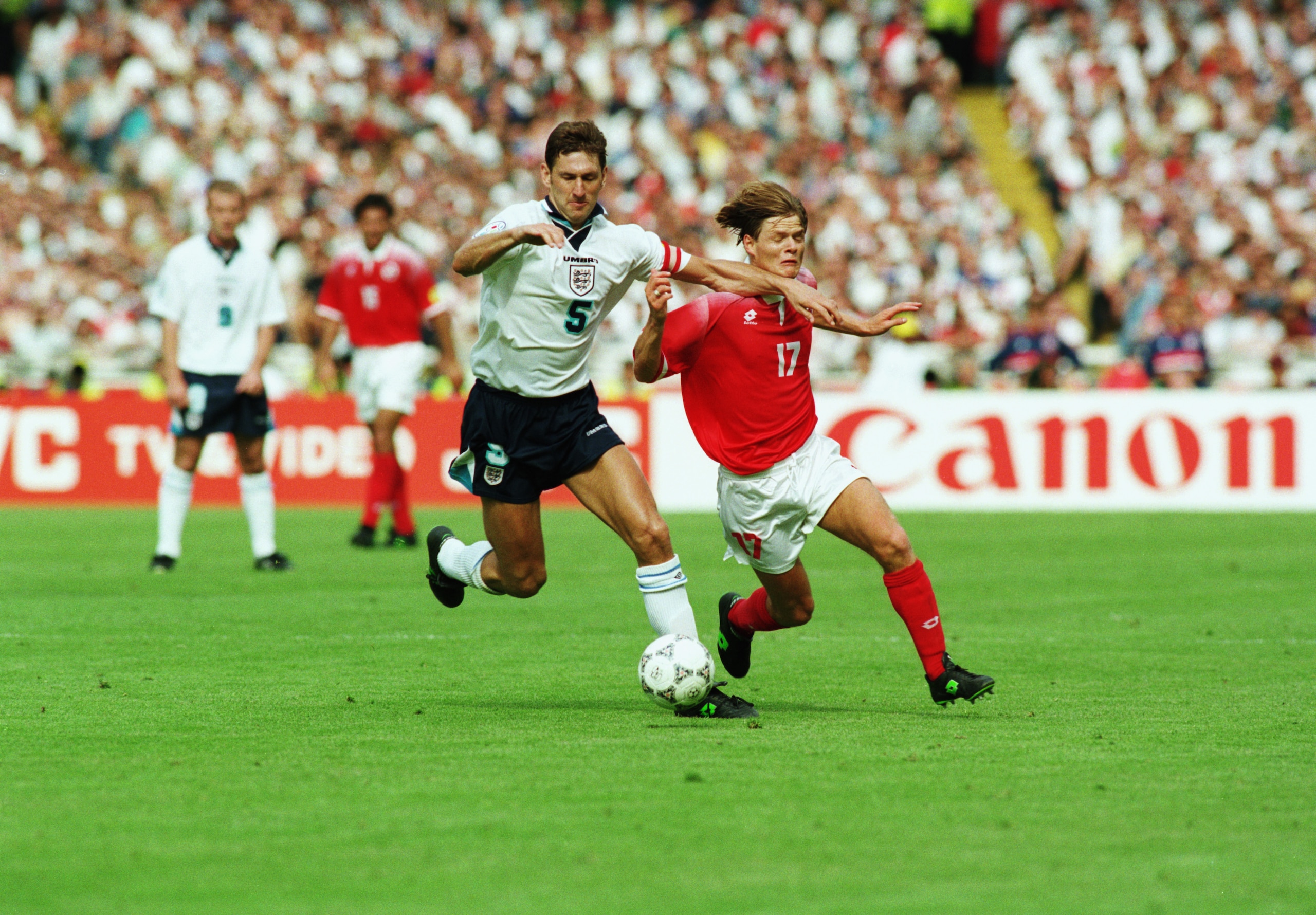LONDON - JUNE 8:  Johann Vogel of Switzerland is blocked off by Tony Adams of England during the UEFA European Championships 1996 Group A match between England and Switzerland held on June 8, 1996 at Wembley, in London. The match ended in a 1-1 draw. (Pho