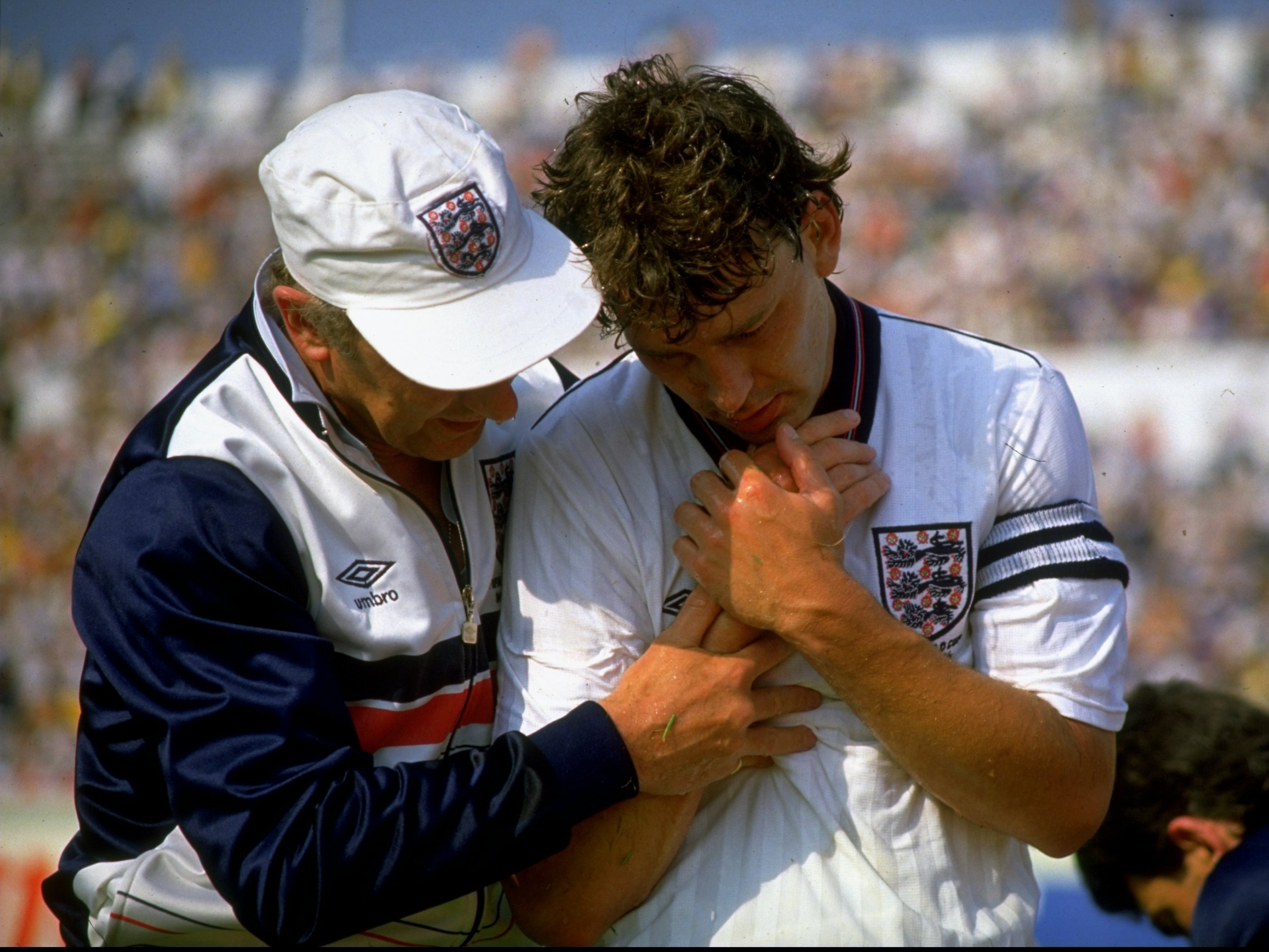 6 Jun 1986:  England captain Bryan Robson is helped off the pitch after injuring his wrist during the World Cup Group F match against Morocco at the Estadio Tecnologico in Monterrey, Mexico.  \ Mandatory Credit: Allsport UK /Allsport