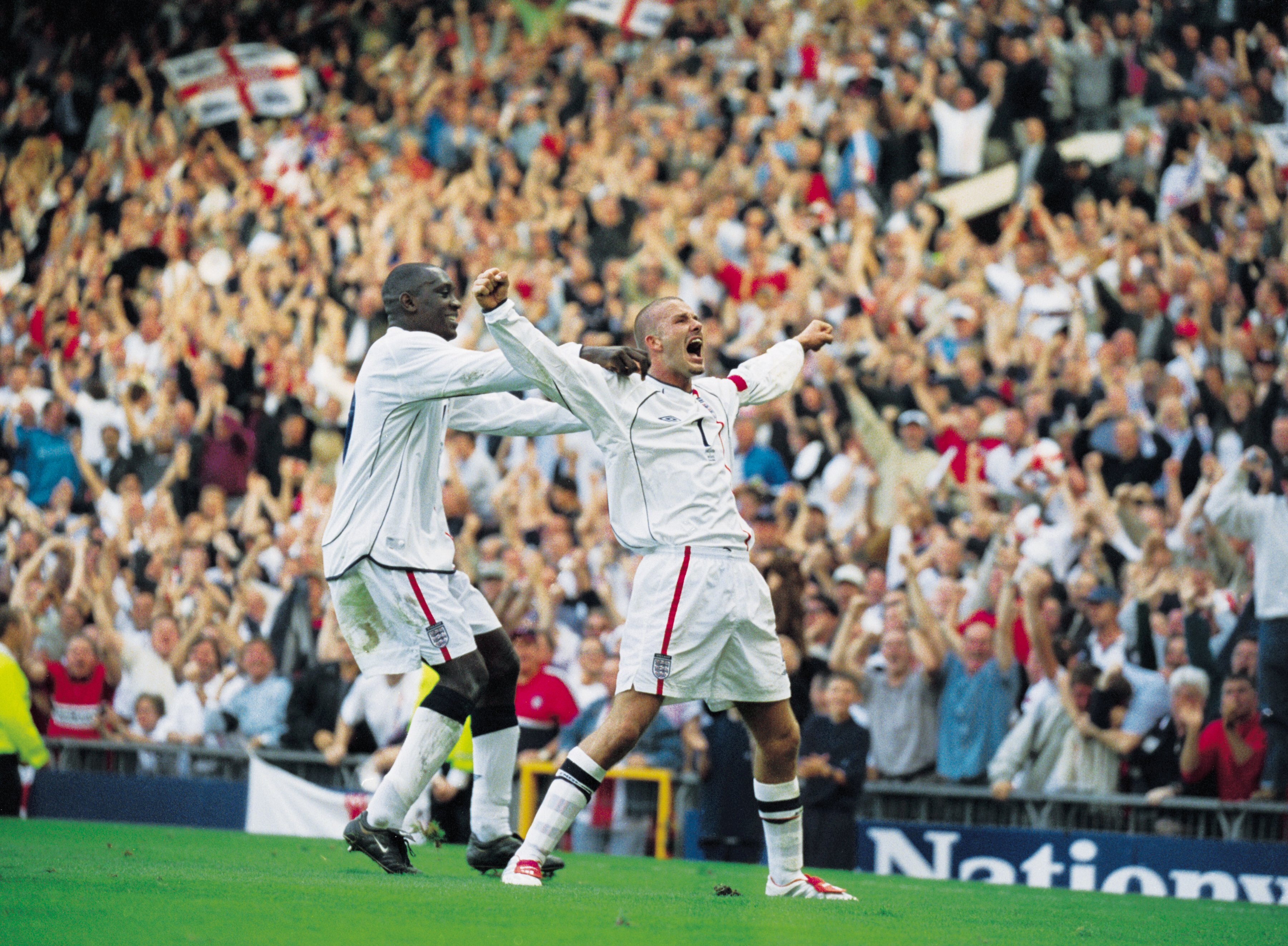 6 Oct 2001:  David Beckham of England celebrates his injury time equalising goal during the World Cup Group 9 Qualifier between England and Greece at Old Trafford in Manchester, England. England sealed qualification after the game ended 2-2.   \ Mandatory