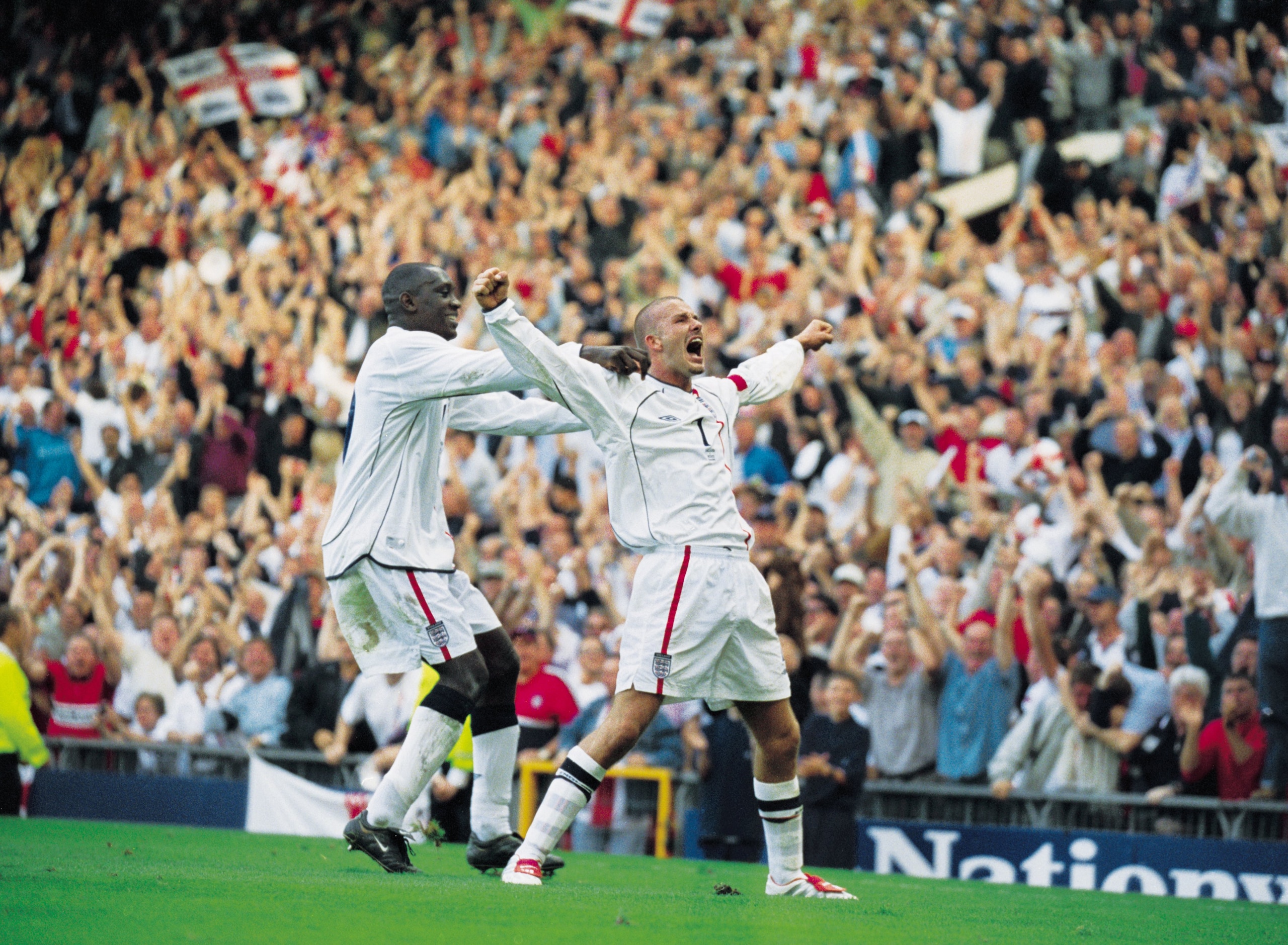 6 Oct 2001:  David Beckham of England celebrates his injury time equalising goal during the World Cup Group 9 Qualifier between England and Greece at Old Trafford in Manchester, England. England sealed qualification after the game ended 2-2.   \ Mandatory