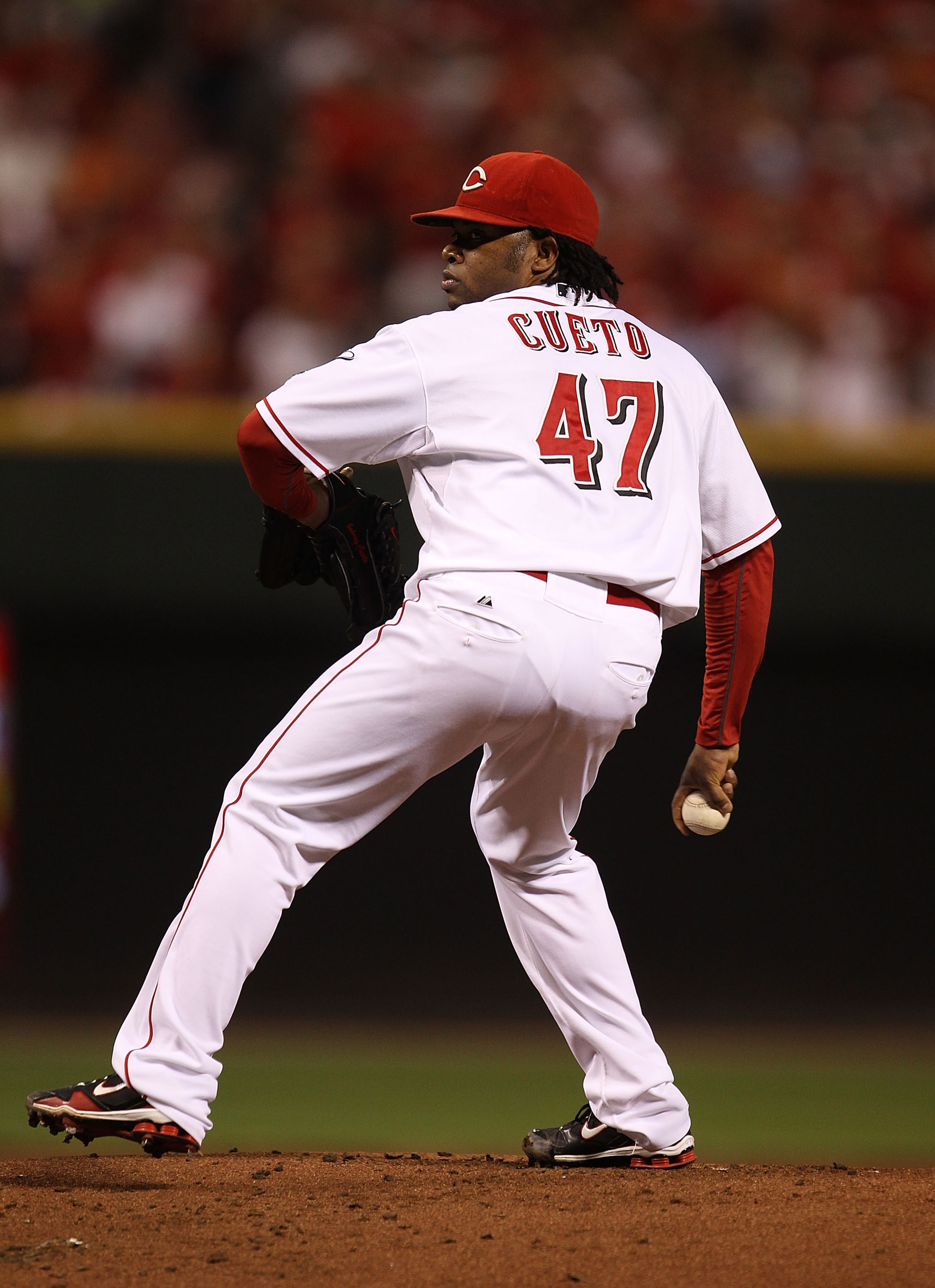 CINCINNATI - OCTOBER 10: Starting pitcher Johnny Cueto #47 of the Cincinnati Reds delivers the ball against the Philadelphia Phillies during game 3 of the NLDS at Great American Ball Park on October 10, 2010 in Cincinnati, Ohio. The Phillies defeated the