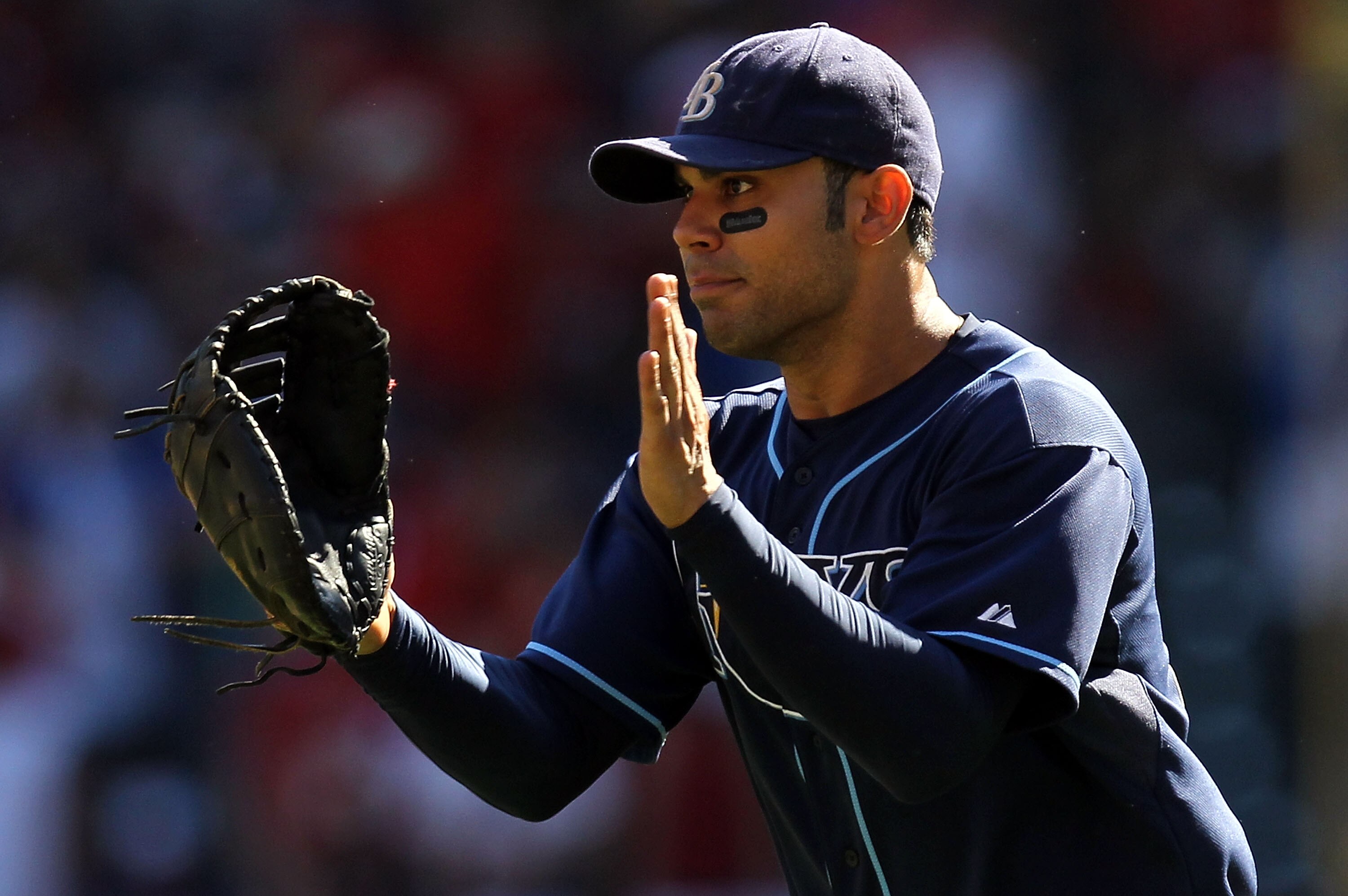 ARLINGTON, TX - OCTOBER 10:  Carlos Pena #23 of the Tampa Bay Rays celebrates after a 5-2 win against the Texas Rangers during game 4 of the ALDS at Rangers Ballpark in Arlington on October 10, 2010 in Arlington, Texas.  (Photo by Ronald Martinez/Getty Im