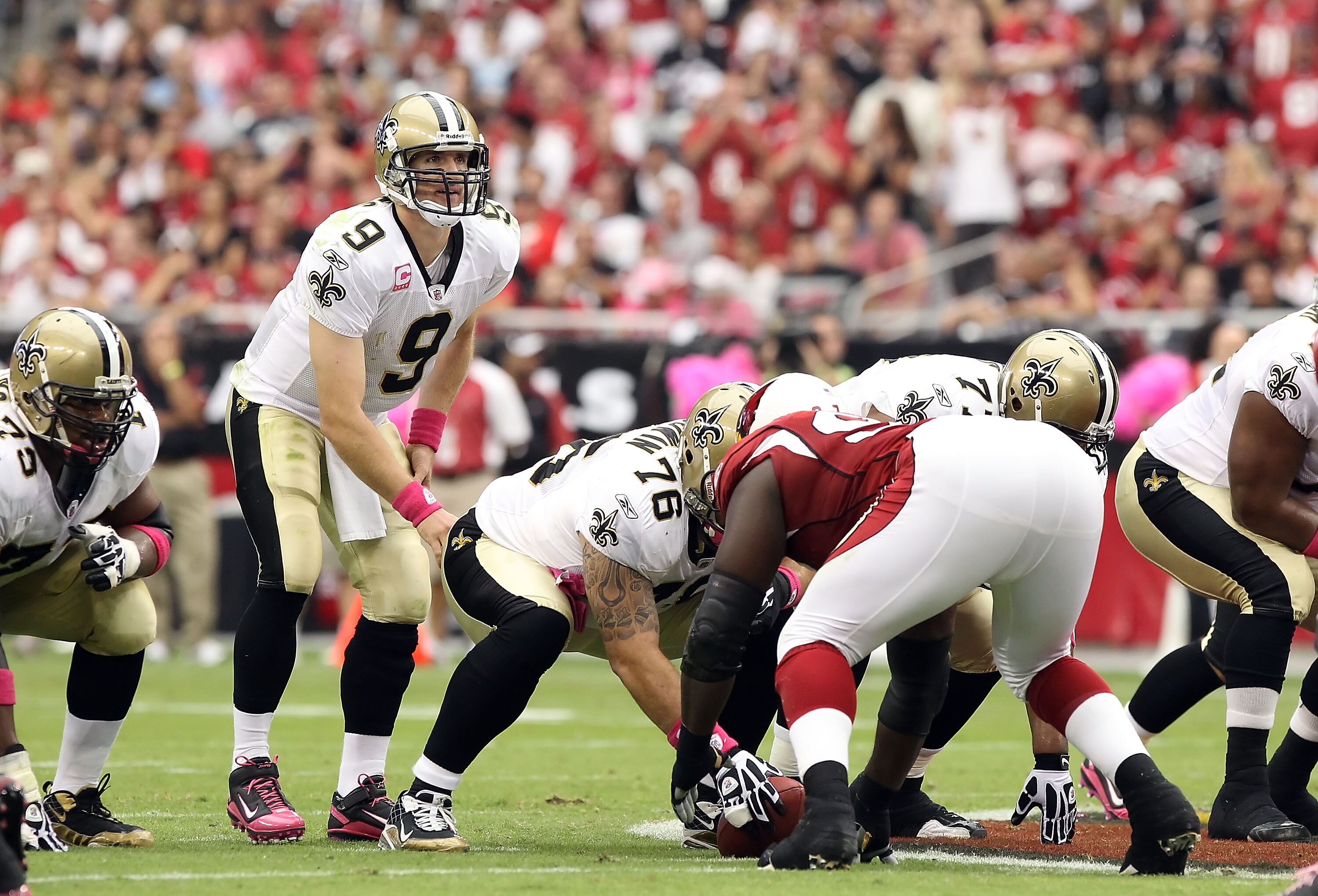 GLENDALE, AZ - OCTOBER 10:  Quarterback Drew Brees #9 of the New Orleans Saints prepares to snap the ball during the NFL game against the Arizona Cardinals at the University of Phoenix Stadium on October 10, 2010 in Glendale, Arizona. The Cardinals defeat