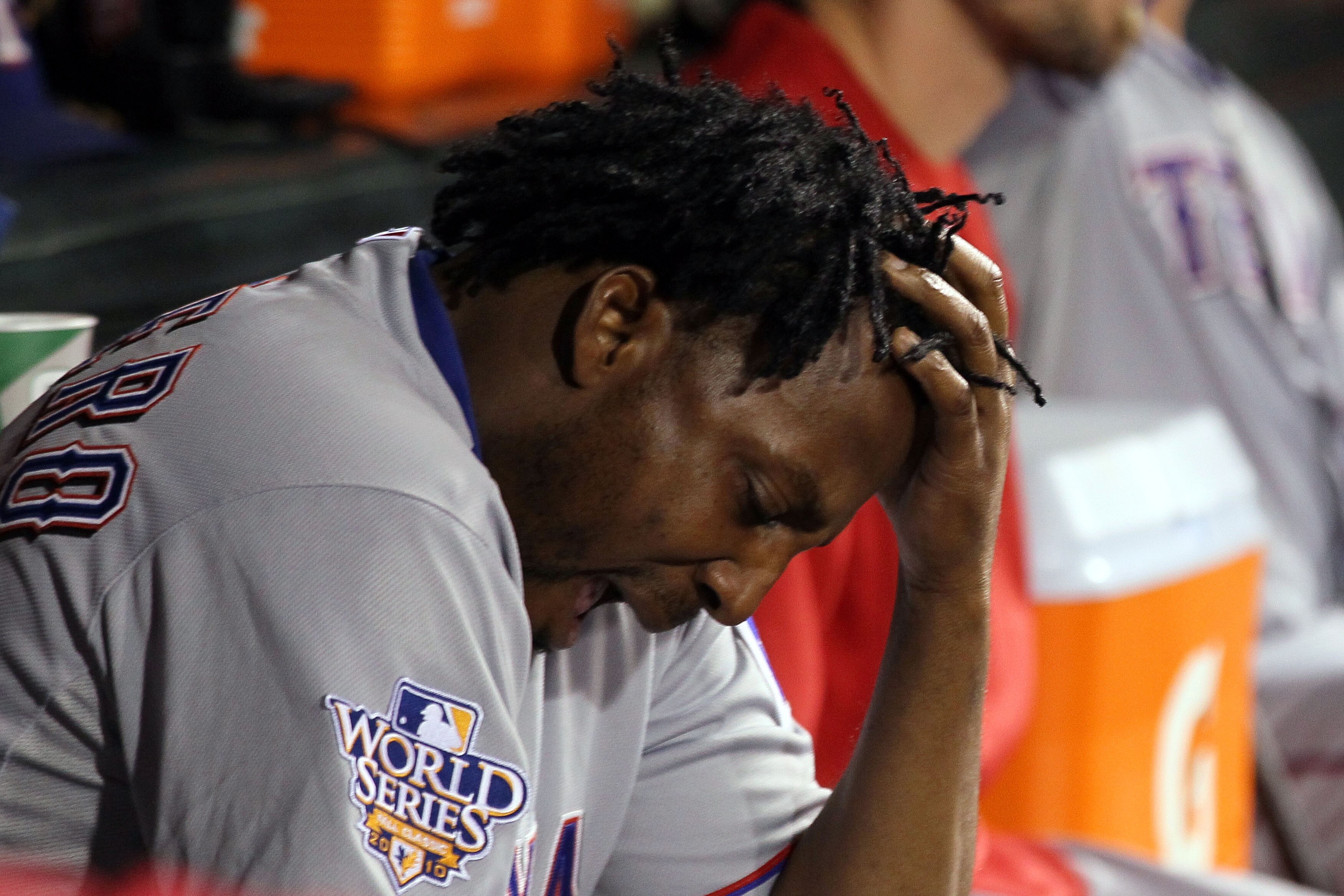SAN FRANCISCO - OCTOBER 28:  Vladimir Guerrero #27 of the Texas Rangers looks on from the dugout late in the game against the San Francisco Giants in Game Two of the 2010 MLB World Series at AT&T Park on October 28, 2010 in San Francisco, California.  (Ph