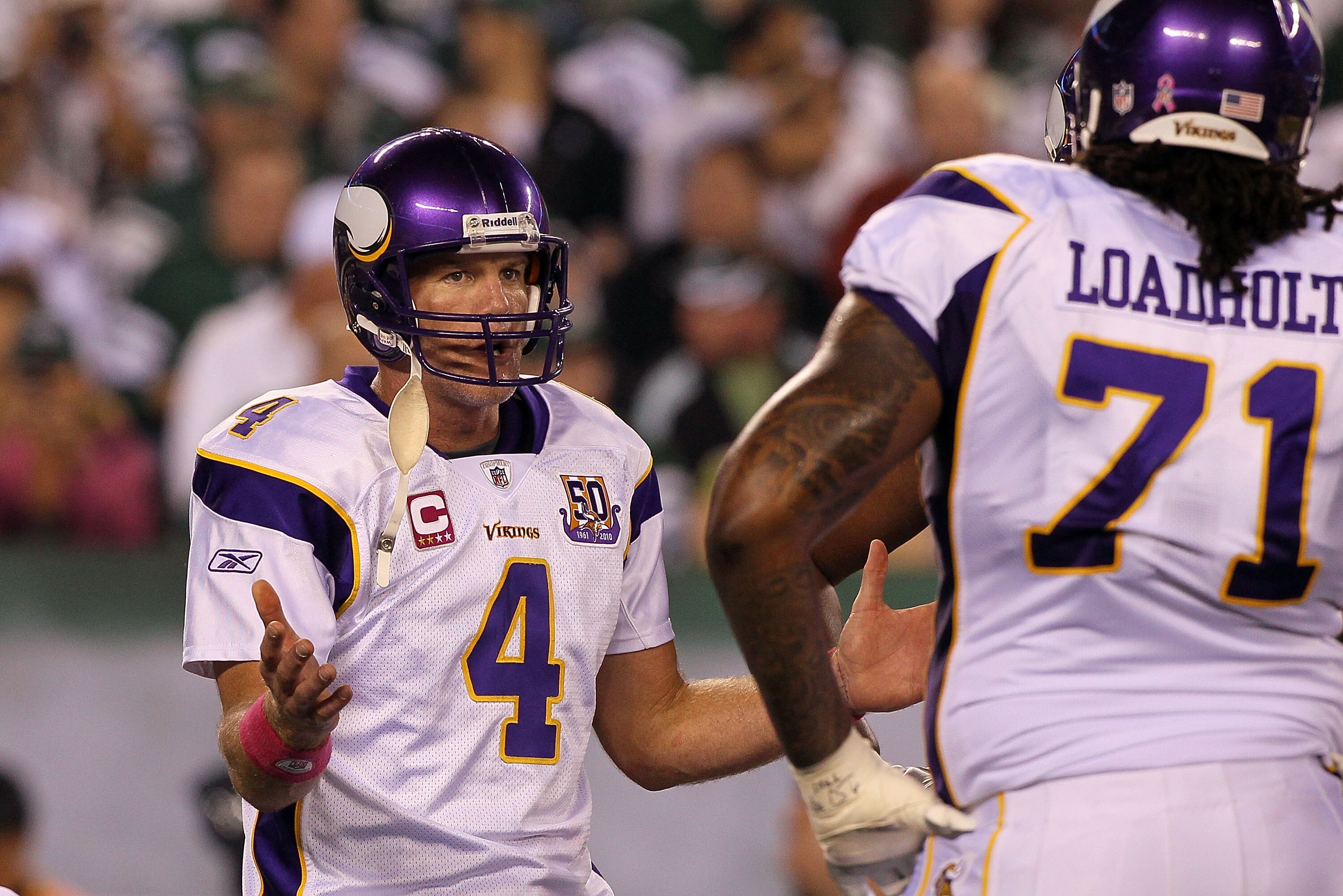 EAST RUTHERFORD, NJ - OCTOBER 11:  Quarterback Brett Favre #4 of the Minnesota Vikings gestures in the huddle in the first half against the New York Jets at New Meadowlands Stadium on October 11, 2010 in East Rutherford, New Jersey.  (Photo by Jim McIsaac