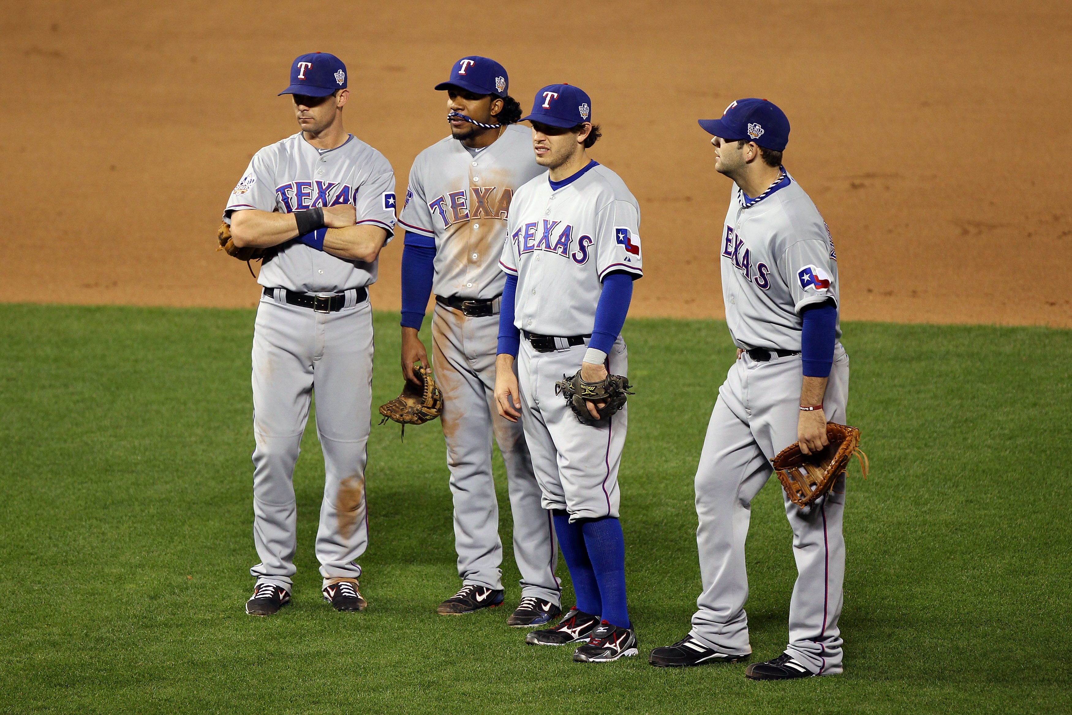 SAN FRANCISCO - OCTOBER 28:  (L-R) Michael Young #10, Ian Kinsler #5, Elvis Andrus #1 and Mitch Moreland #18 of the Texas Rangers stand together during a pitching change in the seventh inning while taking on the San Francisco Giants in Game Two of the 201