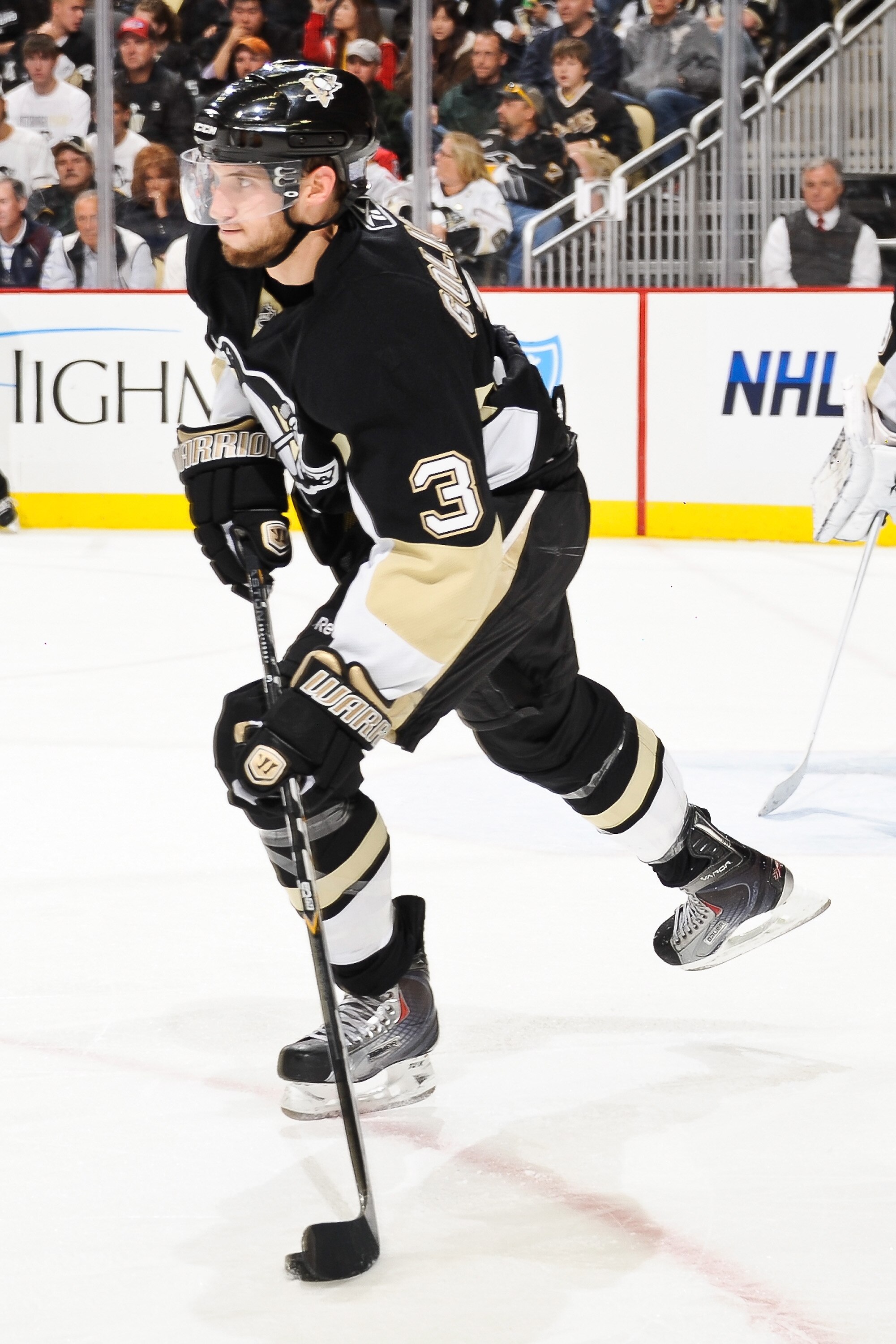 PITTSBURGH - OCTOBER 13:  Alex Goligoski #3 of the Pittsburgh Penguins skates with the puck against the Toronto Maple Leafs on October 13, 2010 at Consol Energy Center in Pittsburgh, Pennsylvania.  (Photo by Jamie Sabau/Getty Images)