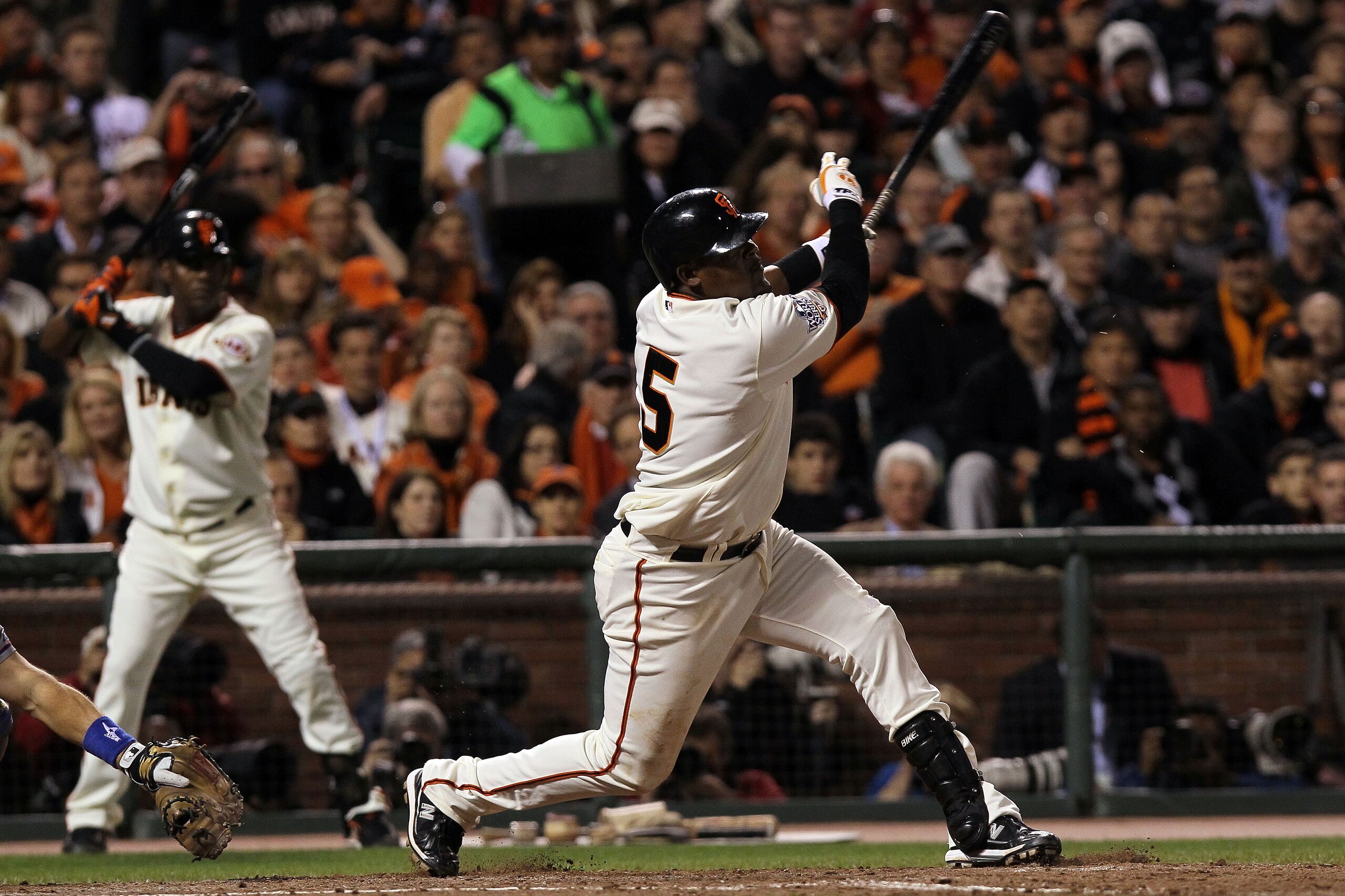 SAN FRANCISCO - OCTOBER 28:  Juan Uribe #5 of the San Francisco Giants hits a RBI double in the seventh inning off Darren Oliver #28 of the Texas Rangers in Game Two of the 2010 MLB World Series at AT&T Park on October 28, 2010 in San Francisco, Californi