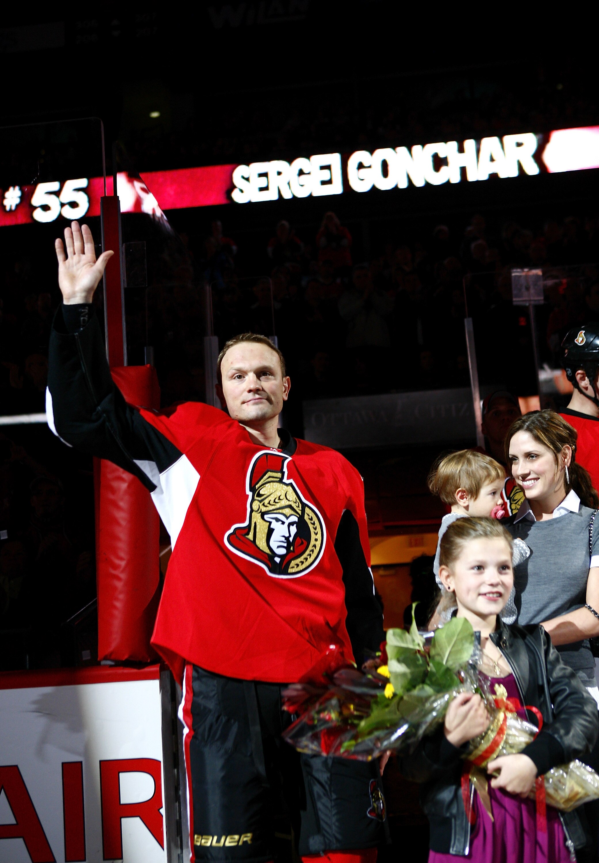 OTTAWA, ON - OCTOBER 26:  Sergei Gonchar #55 of the Ottawa Senators, along with his family,  acknowledges the crowd during a ceremony to celebrate his 1000th NHL regular season game before a game against the Phoenix Coyotes at Scotiabank Place on October 