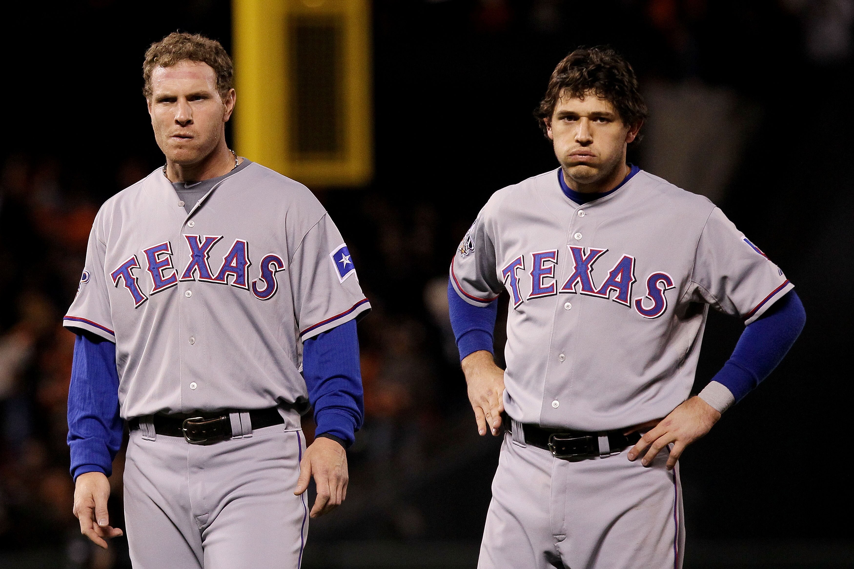 SAN FRANCISCO - OCTOBER 28:  (L-R) Josh Hamilton #32 and Ian Kinsler #5 of the Texas Rangers look on after the end of the top of the sixth inning while taking on the San Francisco Giants in Game Two of the 2010 MLB World Series at AT&T Park on October 28,