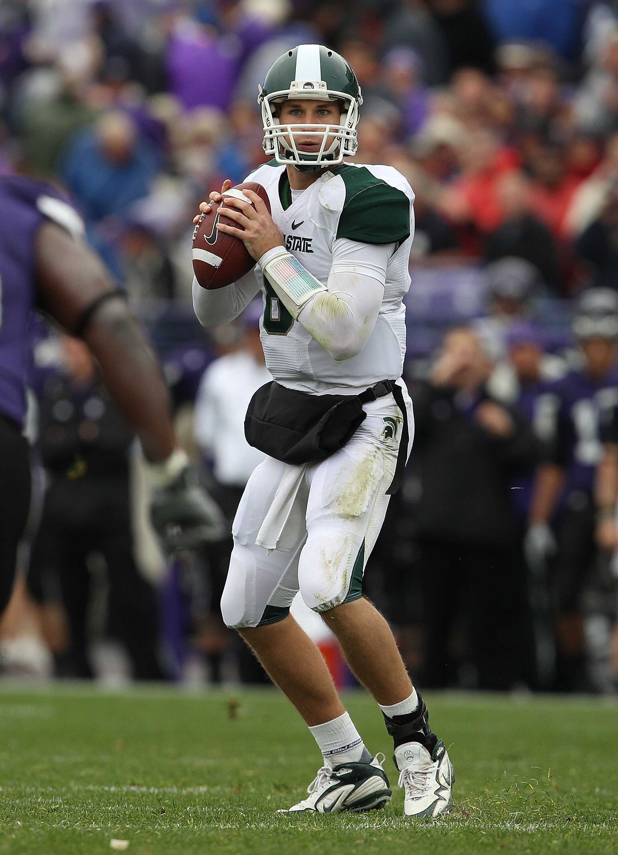 EVANSTON, IL - OCTOBER 23: Kirk Cousins #8 of the Michigan State Spartans looks for a receiver against the Northwestern Wildcats at Ryan Field on October 23, 2010 in Evanston, Illinois. Michigan State defeated Northwestern 35-27. (Photo by Jonathan Daniel
