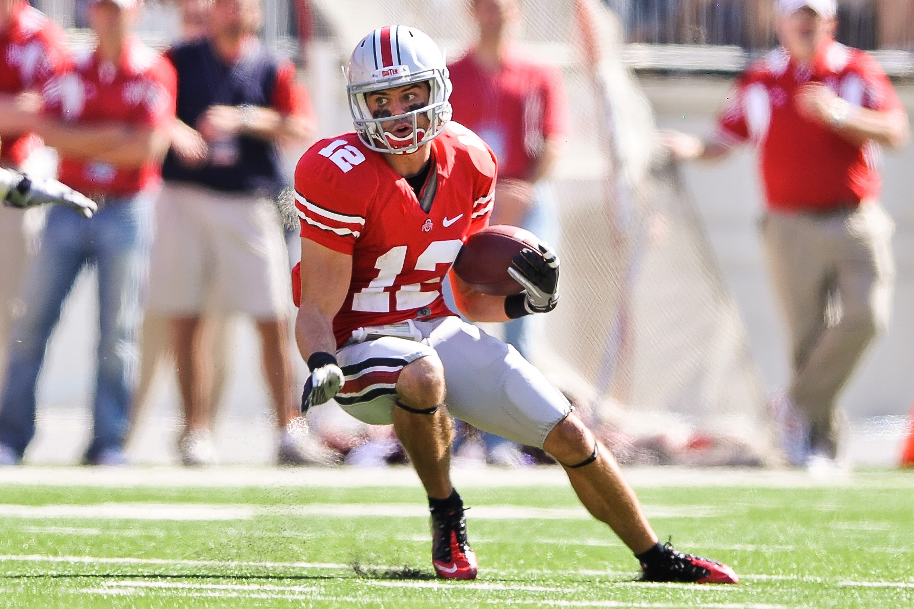 COLUMBUS, OH - OCTOBER 9:  Dane Sanzenbacher #12 of the Ohio State Buckeyes runs with the ball against the Indiana Hoosiers at Ohio Stadium on October 9, 2010 in Columbus, Ohio.  (Photo by Jamie Sabau/Getty Images)