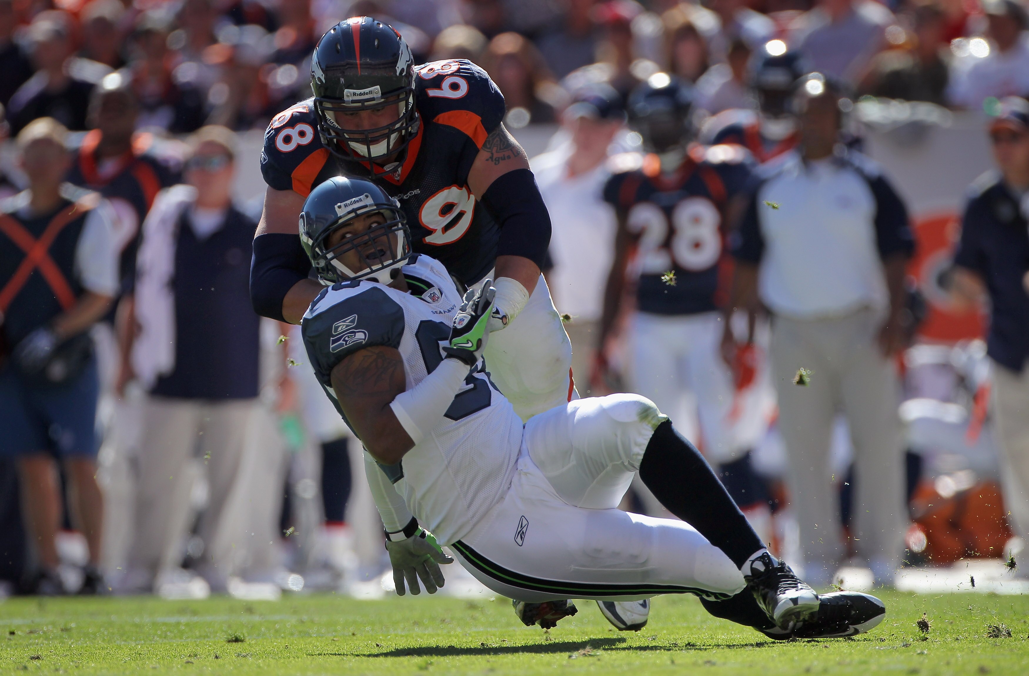 DENVER - SEPTEMBER 19:  Offensive lineman Zane Beadles #68 of the Denver Broncos blocks defensive end Raheem Brock #98 of the Seattle Seahawks at INVESCO Field at Mile High on September 19, 2010 in Denver, Colorado. The Broncos defeated the Seahawks 31-14