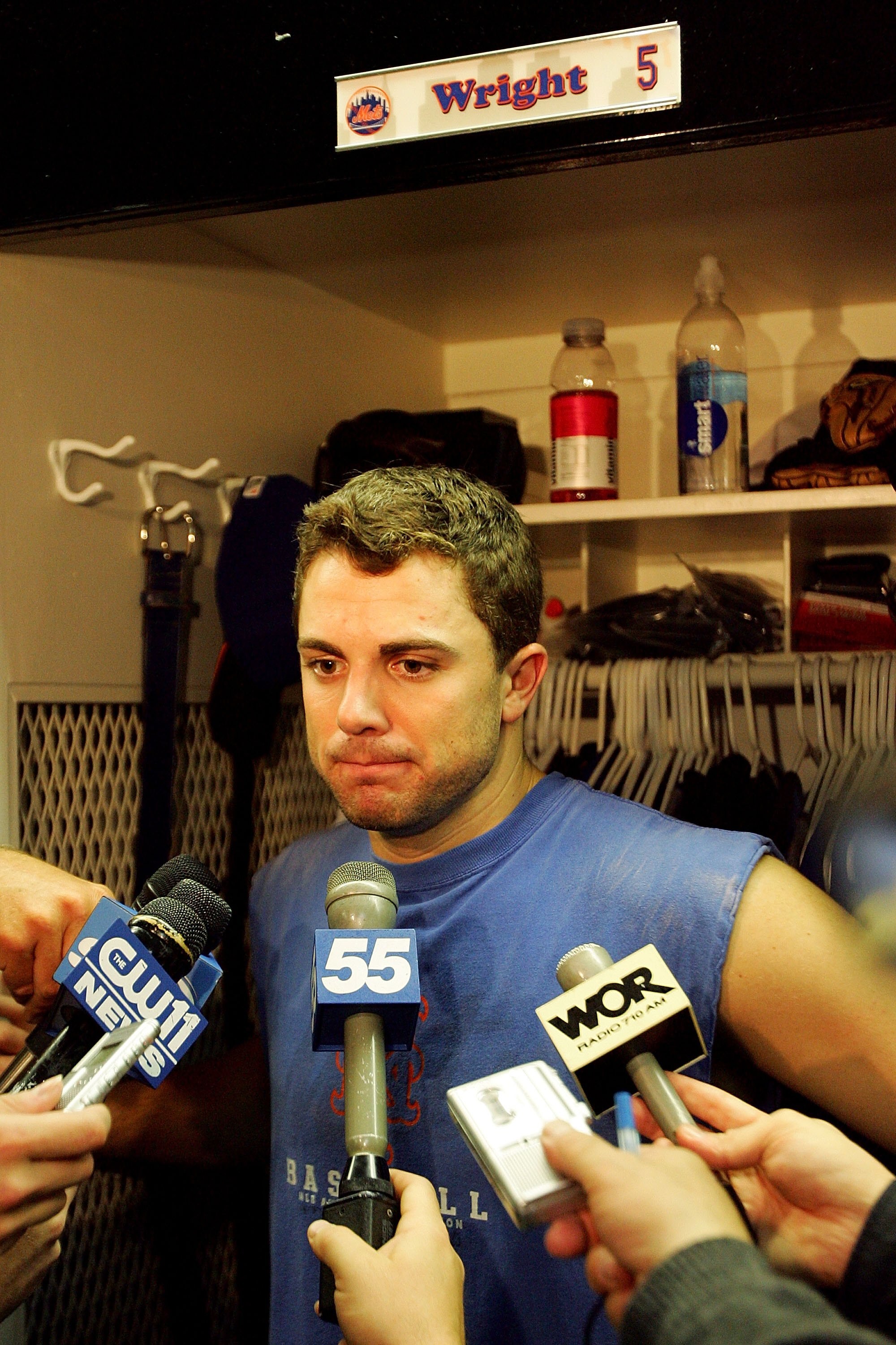 NEW YORK - OCTOBER 19:  David Wright #5 of the New York Mets talks to the media in the locker room after losing to the St. Louis Cardinals 3-1 in game seven of the NLCS at Shea Stadium on October 19, 2006 in the Flushing neighborhood of the Queens borough
