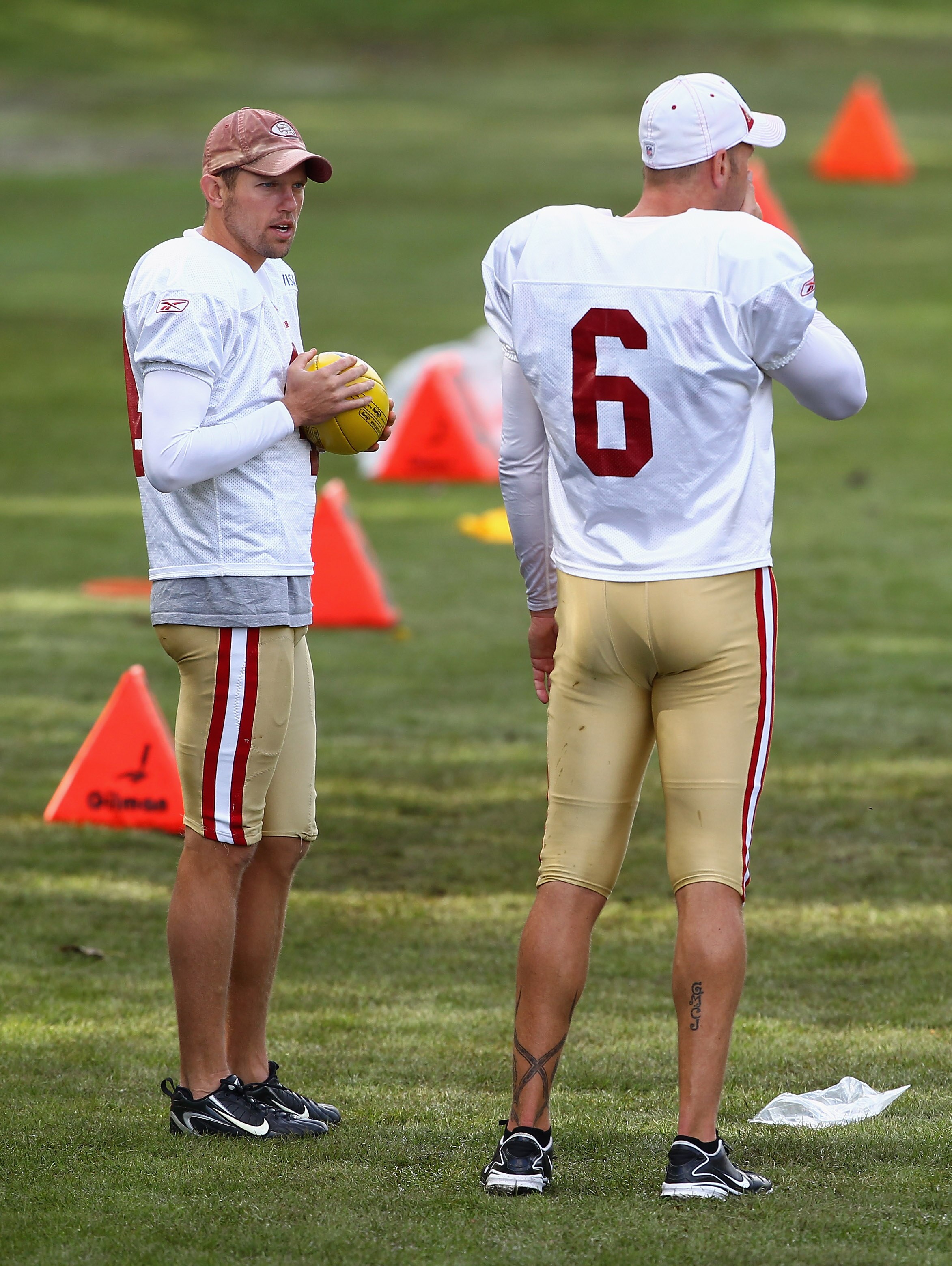 HERTFORD, ENGLAND - OCTOBER 27:  Andy Lee (L) and Joe Nedney of San Francisco 49ers have a chat  during a training session at The Grove Hotel on October 27, 2010 in Hertford, England. The San Francisco 49ers will meet the Denver Broncos in the NFL Interna