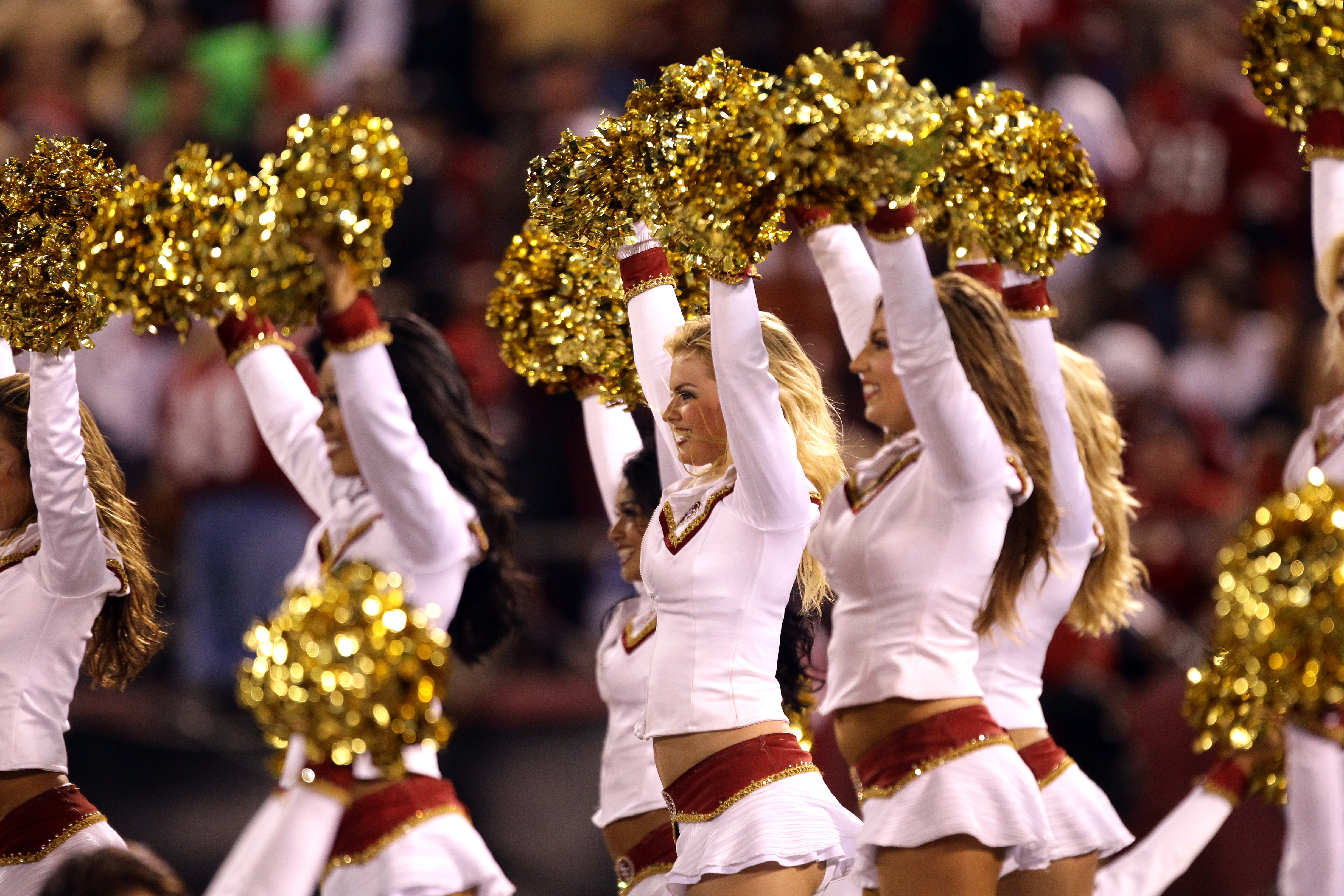 SAN FRANCISCO - SEPTEMBER 20:  The Gold Rush San Francisco 49ers cheerleaders cheer for their team during their game against the New Orleans Saints at Candlestick Park on September 20, 2010 in San Francisco, California.  (Photo by Ezra Shaw/Getty Images)