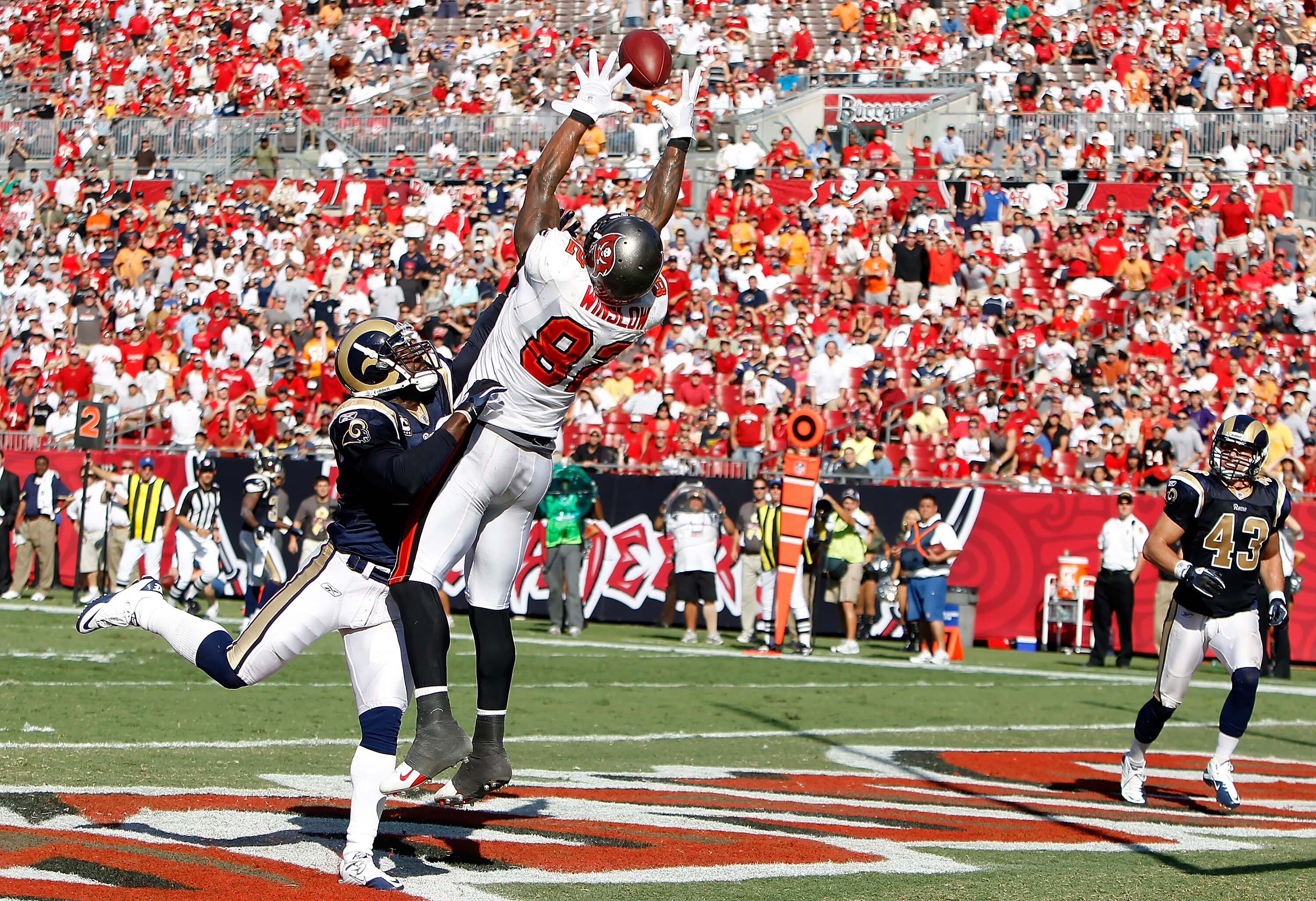TAMPA, FL - OCTOBER 24:  Tightend Kellen Winslow #82 of the Tampa Bay Buccaneers cannot bring in this pass as safety Oshiomogho Atogwe #21 of the St. Louis Rams breaks it up during the game at Raymond James Stadium on October 24, 2010 in Tampa, Florida.  