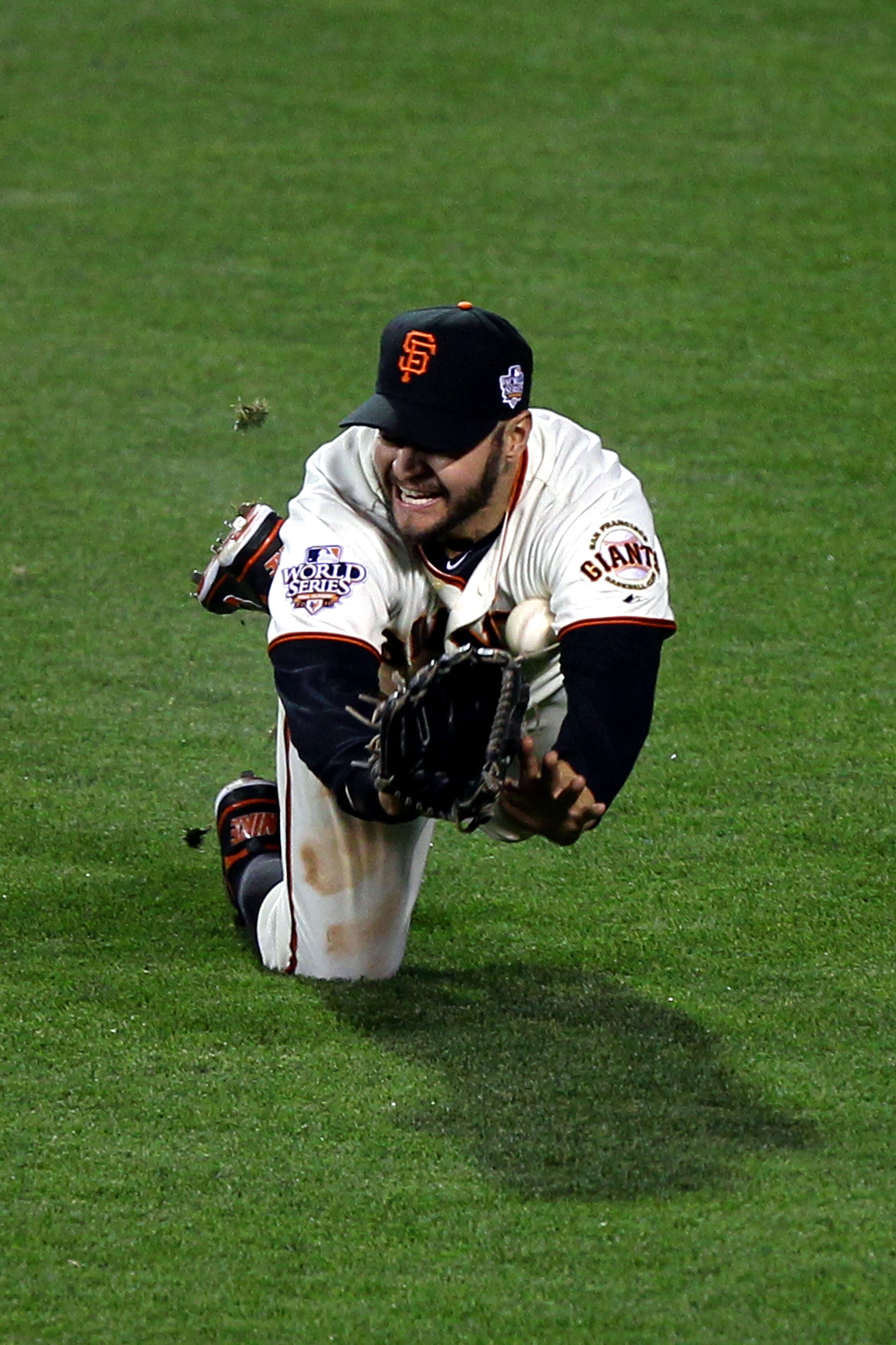 SAN FRANCISCO - OCTOBER 28:  Cody Ross #13 of the San Francisco Giants is unable to catch a ball hit by Josh Hamilton #32 of the Texas Rangers leading to single for Hamilton in the sixth inning of Game Two of the 2010 MLB World Series at AT&T Park on Octo