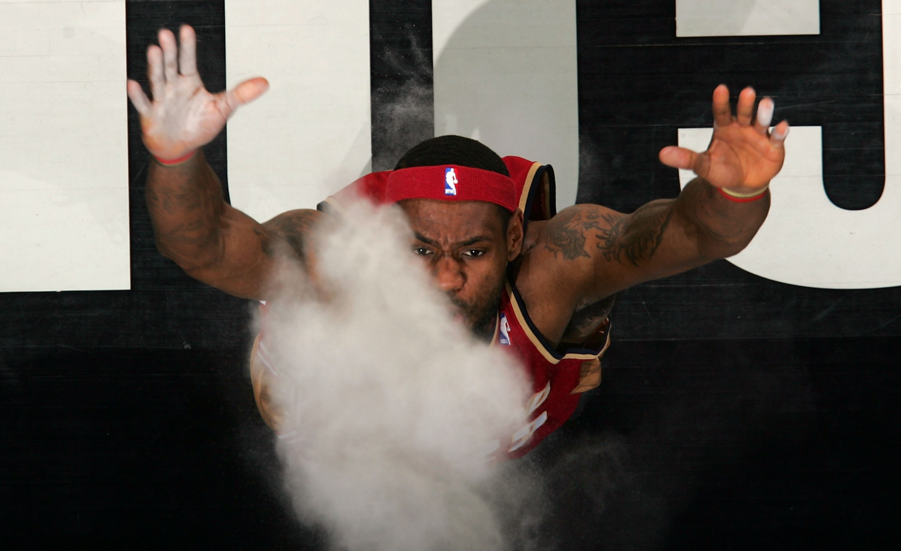 SAN ANTONIO, TX- JANUARY 17:   Forward LeBron James #23 of the Cleveland Cavaliers throws chalk in the air before play with the San Antonio Spurs on January 17, 2008 at AT&T Center in San Antonio, Texas.  NOTE TO USER: User expressly acknowledges and agre